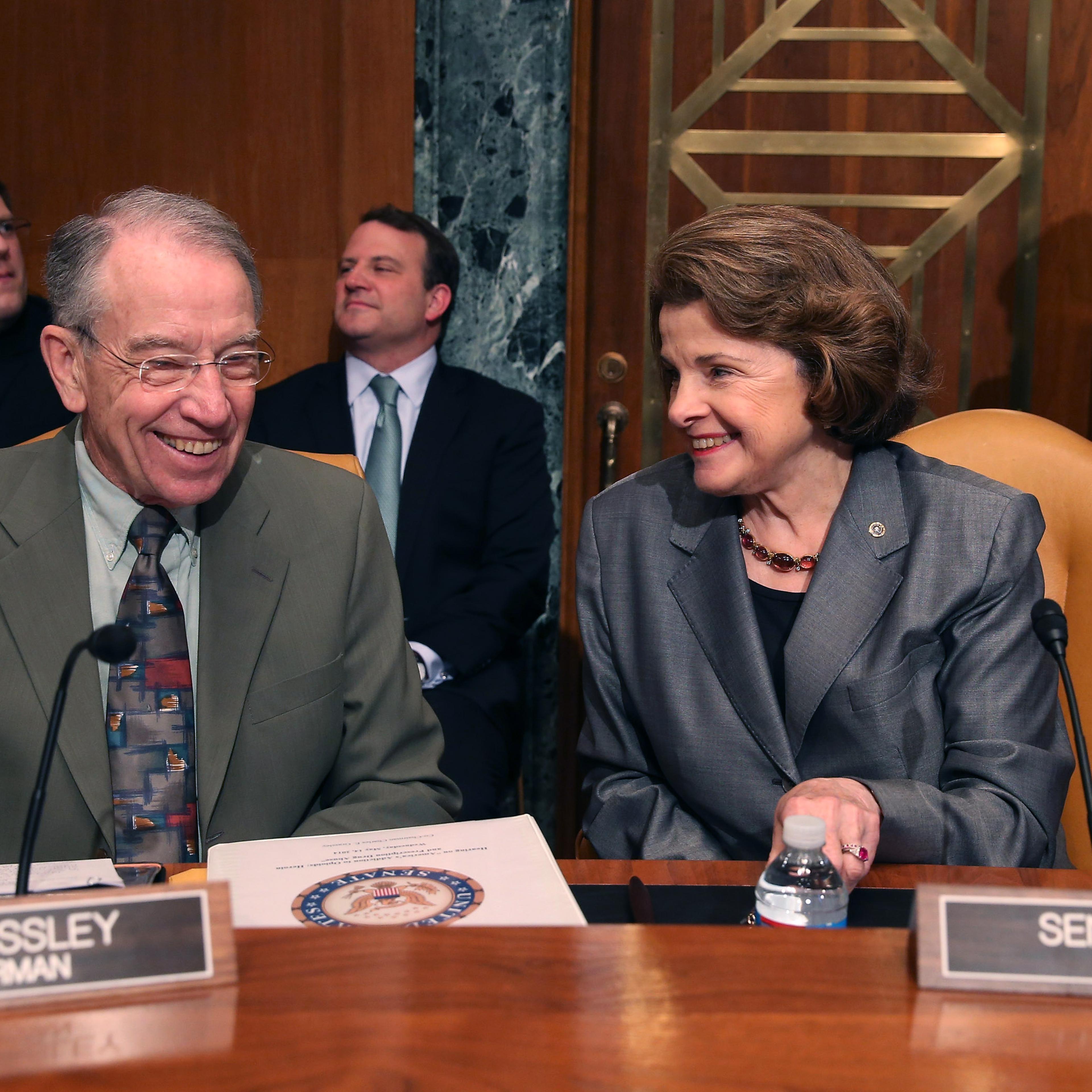 U.S. Sen. Dianne Feinstein (D-CA) (R) and U.S. Sen. Chuck Grassley (R-IA) talk during s Senate Caucus on International Narcotics Control hearing on Capitol Hill in Washington, DC, on May 14, 2014.