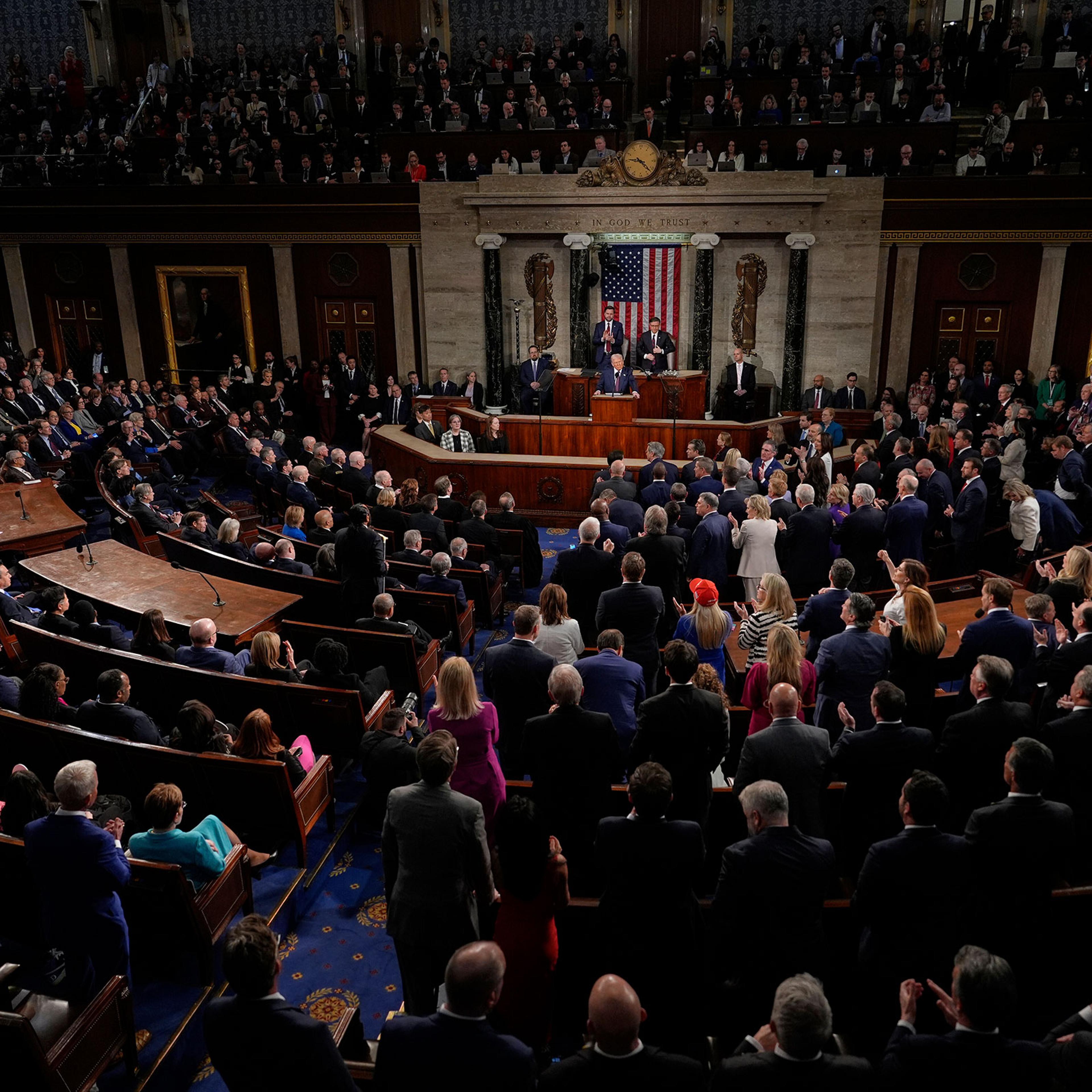 Republicans stand as Democrats sit as President Donald Trump addresses a joint session of Congress in the House chamber at the Capitol in Washington, on March 4, 2025.