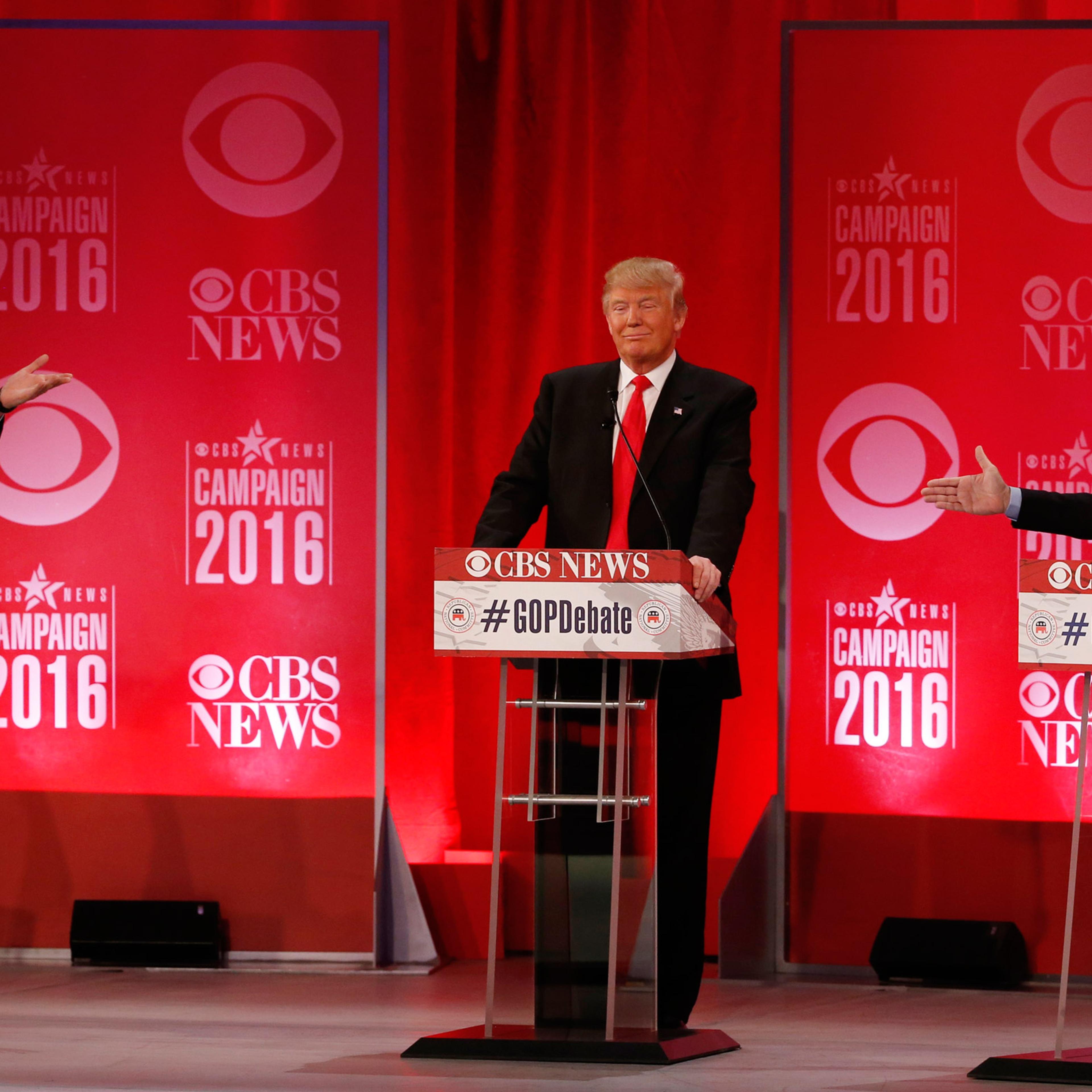 Republican U.S. presidential candidates Senator Ted Cruz (L) and Senator Marco Rubio (R) both gesture at businessman Donald Trump (C) during the Republican U.S. presidential candidates debate sponsored by CBS News and the Republican National Committee in