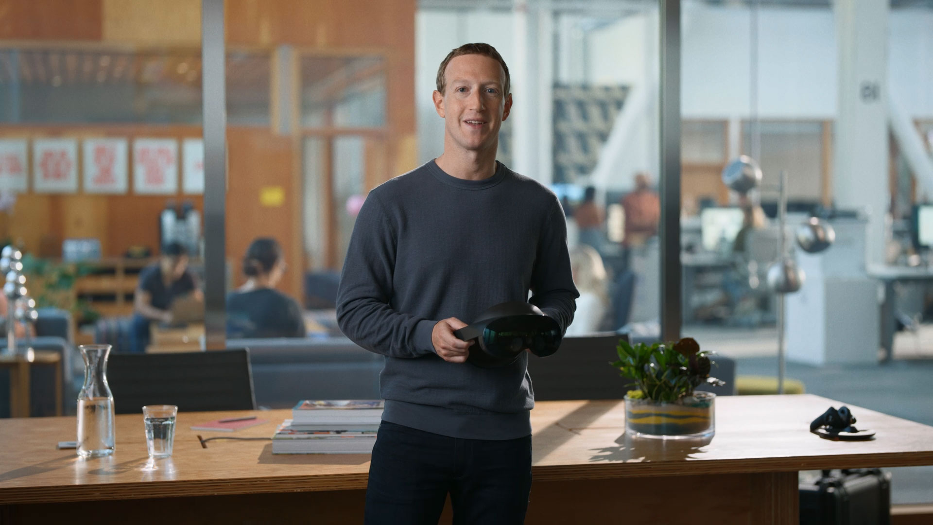 Mark Zuckerberg holds his company's new VR headset, the Meta Quest Pro.