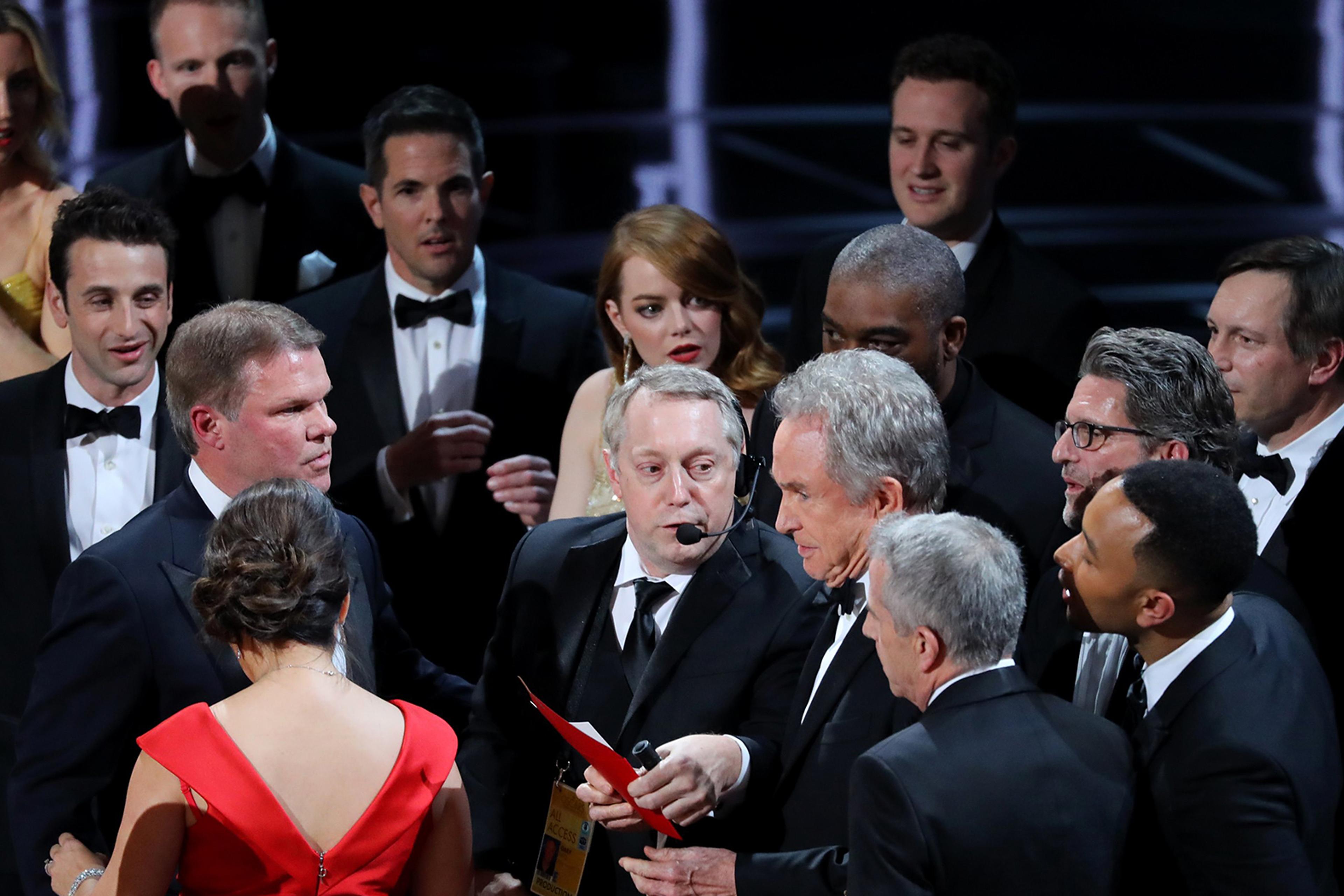 Warren Beatty holds the card for the Best Picture Oscar awarded to Moonlight, after announcing by mistake that La La Land was winner, on Feb. 27, 2017 in Hollywood, Calif.