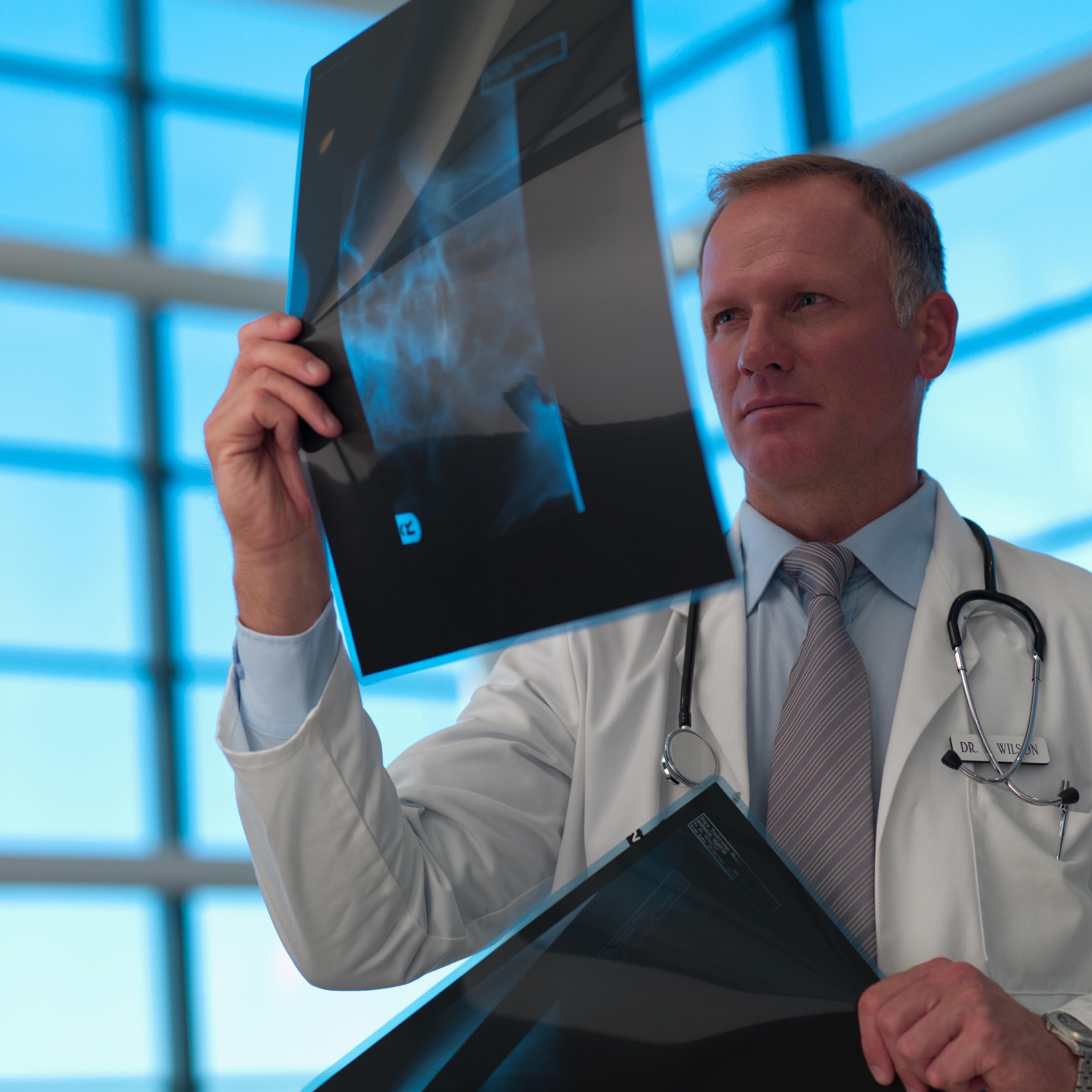 Doctor looking at x-ray