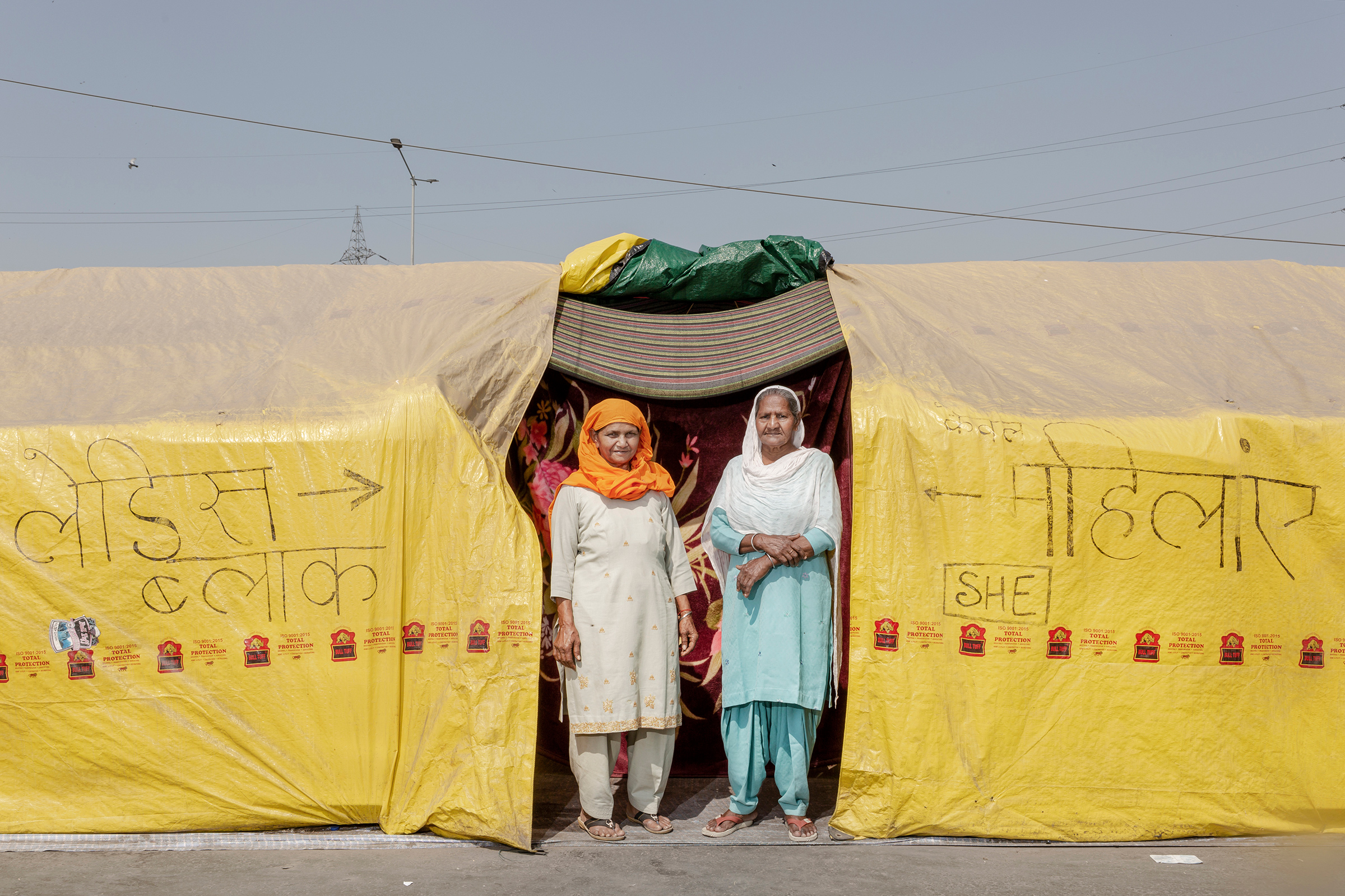 Sarjit Kaur, left, and Dilbeer Kaur, right, from Rampur, Uttar Pradesh, have been at the protests for two months. “We are here to show solidarity and support,” Dilbeer says. Prime Minister Modi is “making us leave our farms and sit here to fight for our rights. We are here to get these laws repealed, and we will be here till we get it done.”