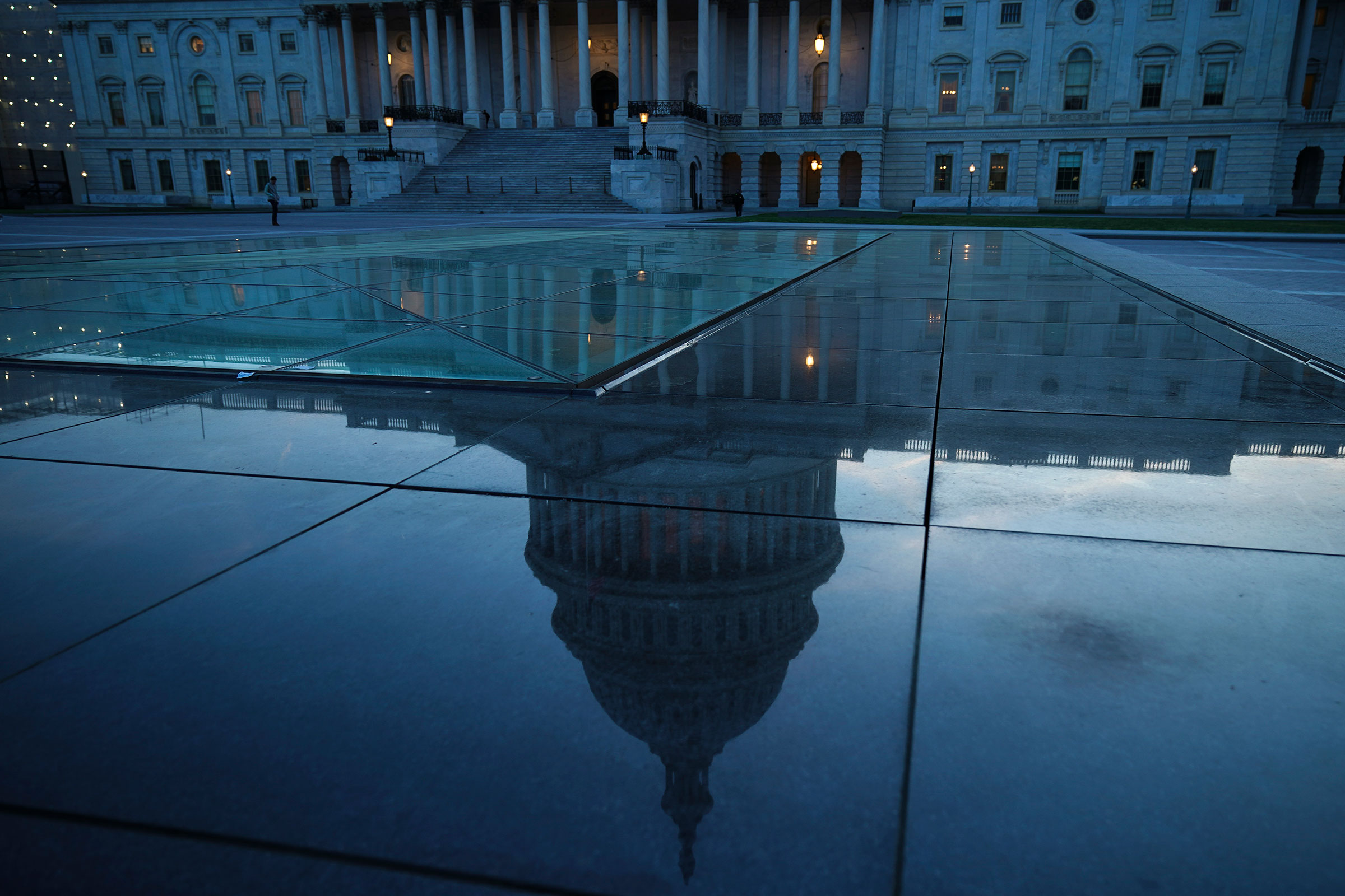 The U.S. Capitol dome is reflected on the plaza of the East Front of the U.S. Capitol, in Washington, DC on April 17, 2019.