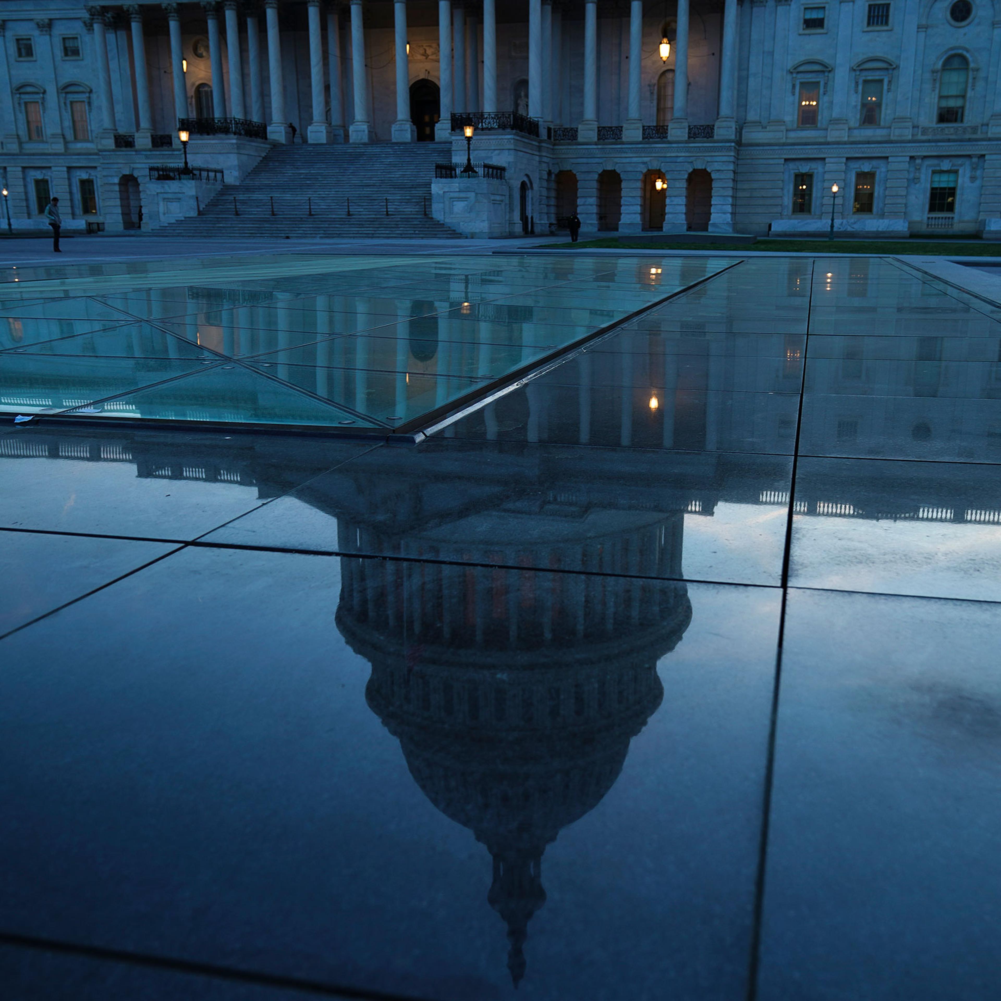 The U.S. Capitol dome is reflected on the plaza of the East Front of the U.S. Capitol, in Washington, DC on April 17, 2019.