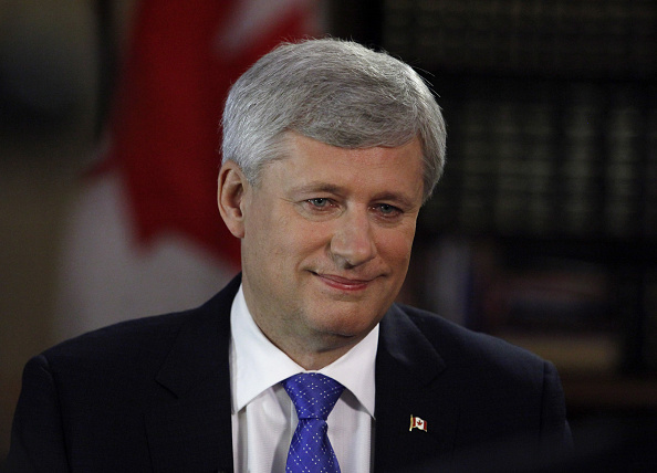 Stephen Harper, Canada's prime minister, smiles after a Bloomberg Television interview in Ottawa, Ontario, Canada, on July 29, 2015