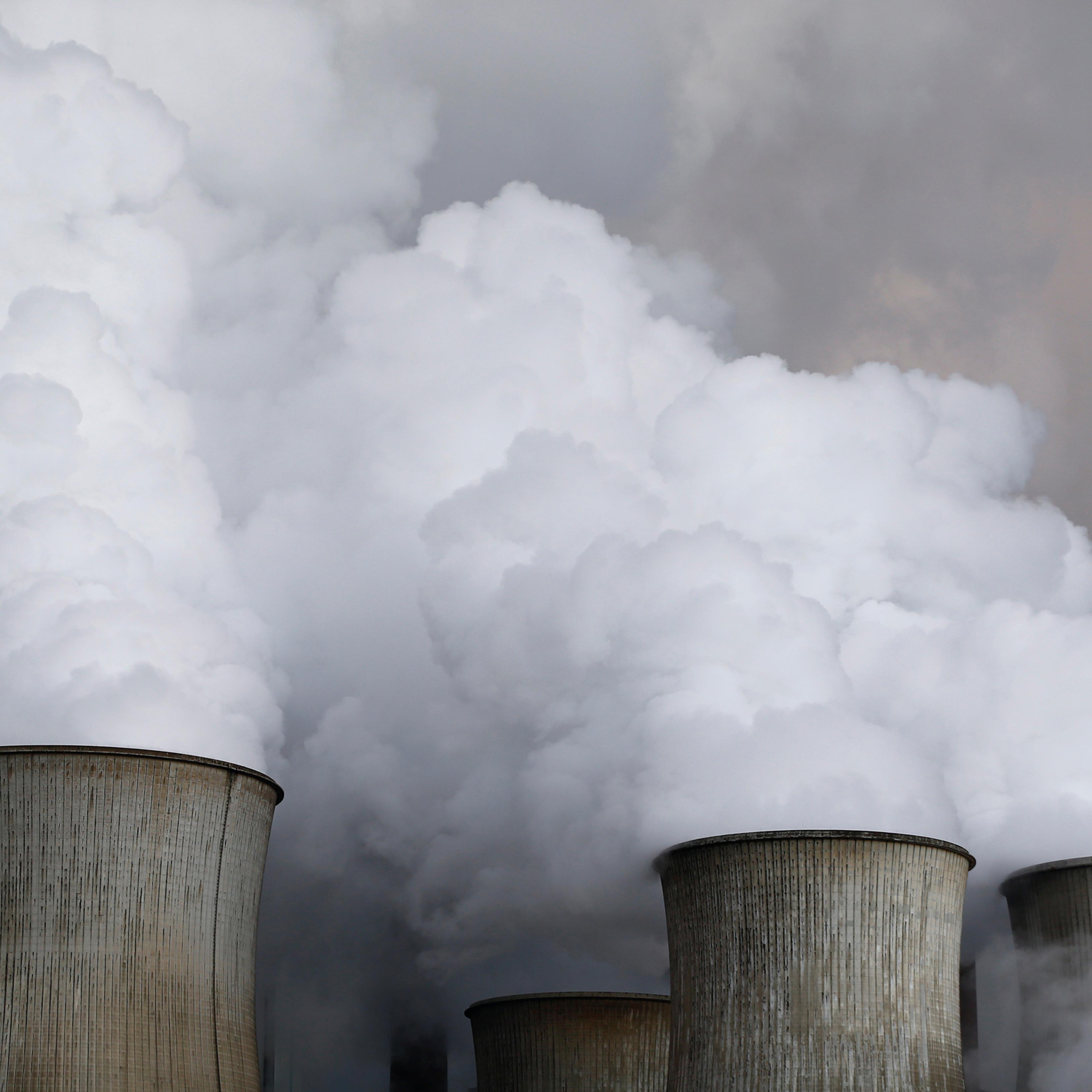 Steam rises from the cooling towers of the coal power plant of RWE, one of Europe's biggest electricity and gas companies in Niederaussem, Germany, March 3, 2016. REUTERS/Wolfgang Rattay/File Photo - RTSPG5G