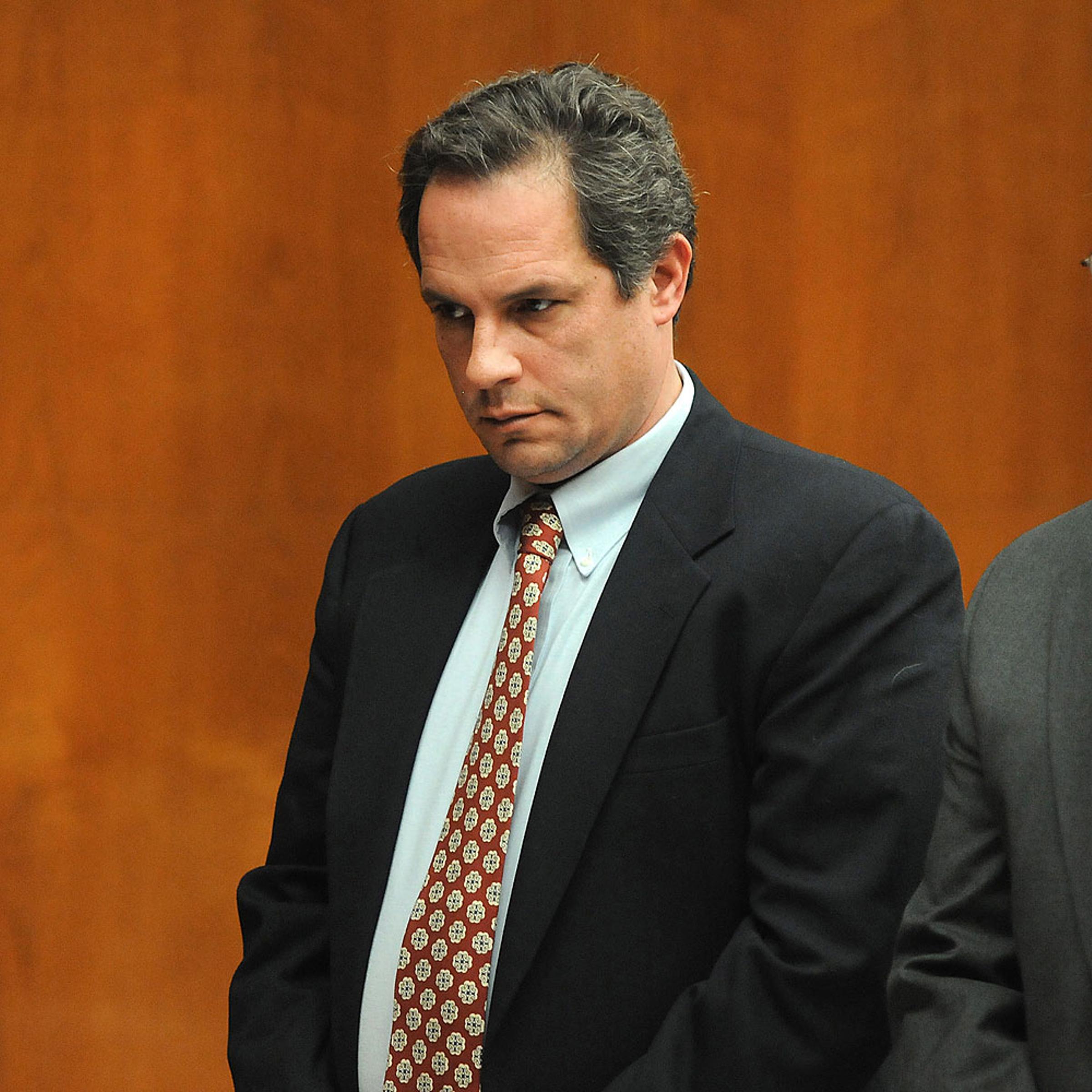Thomas Rica, a former Ridgewood borough employee, stands with his attorney Robert Galantucci, during a hearing at the Bergen County Courthouse Wednesday, March 19, 2014, in Hackensack, N.J.