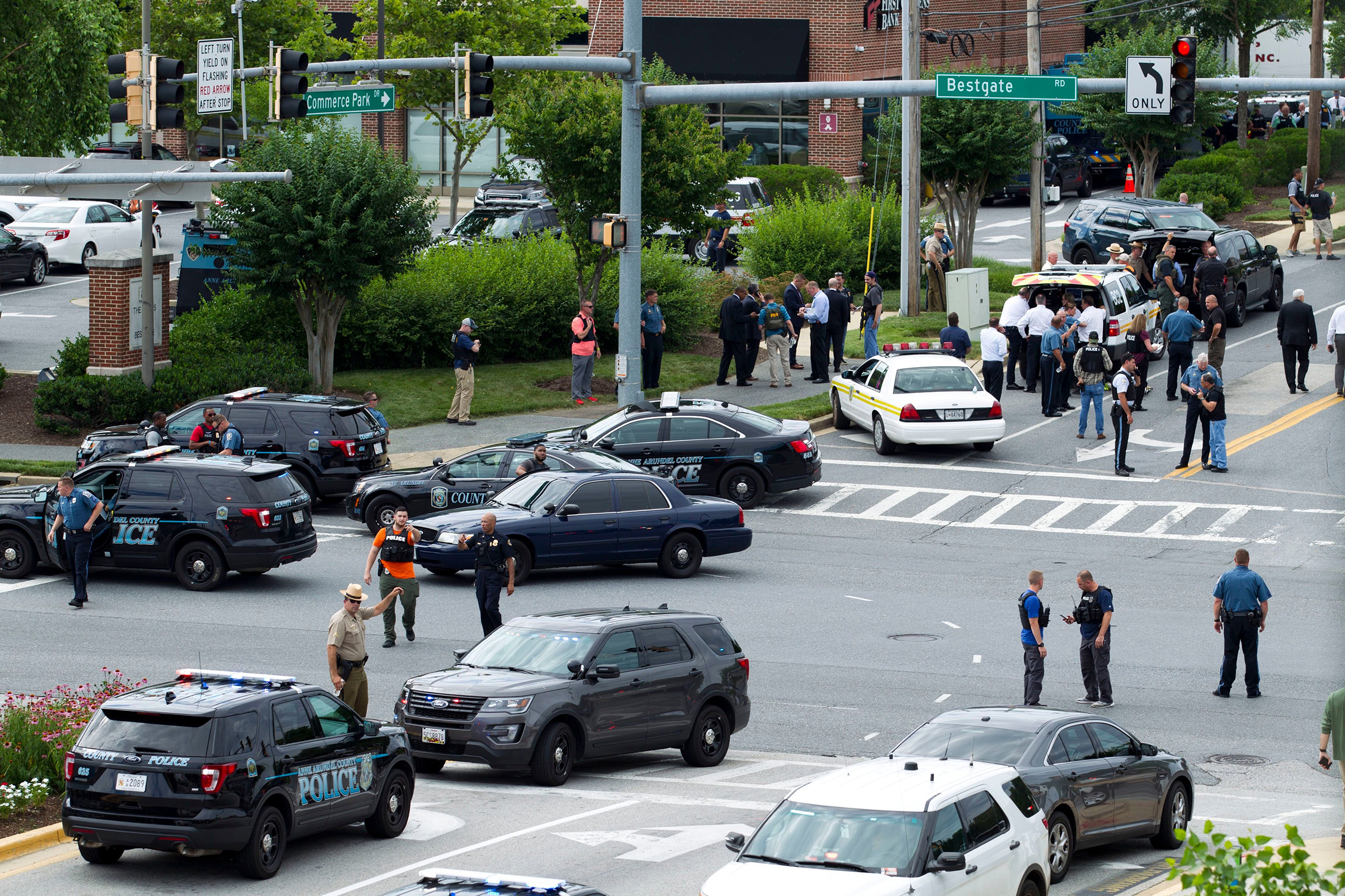 Maryland police officers block the intersection at the building entrance, after multiple people were shot at a newspaper in Annapolis, Md on June 28, 2018.