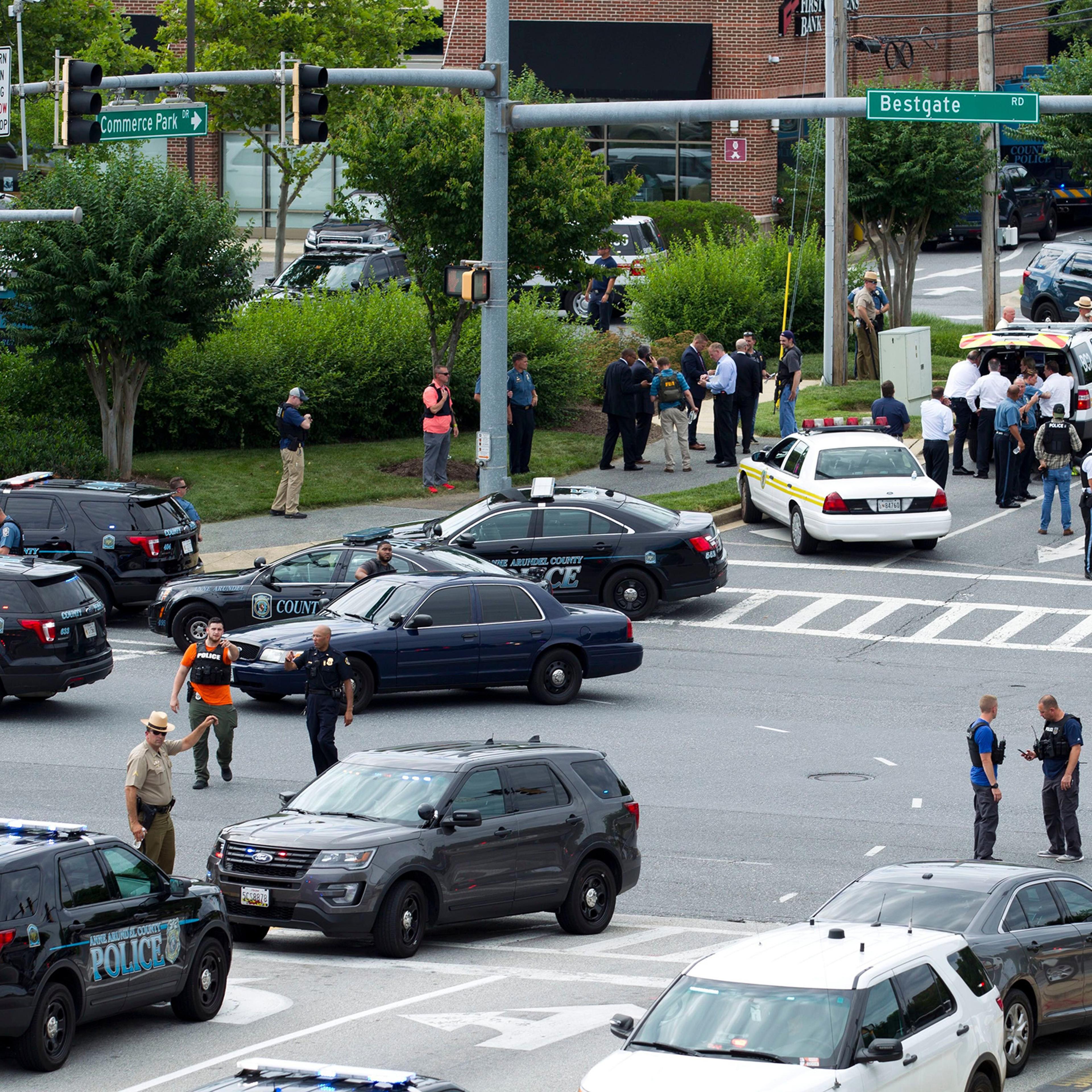 Maryland police officers block the intersection at the building entrance, after multiple people were shot at a newspaper in Annapolis, Md on June 28, 2018.