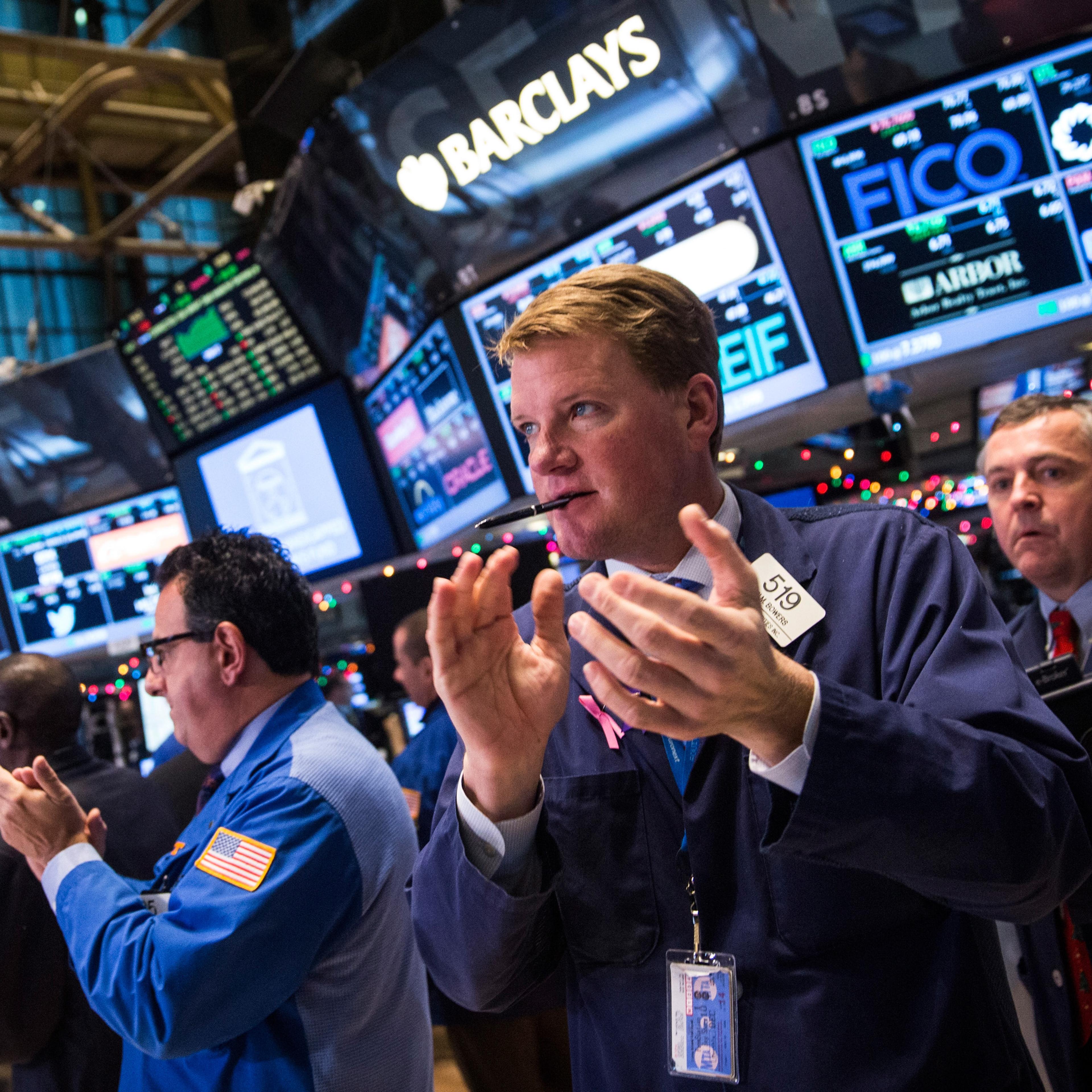 Traders on the floor of the New York Stock Exchange on Dec. 18, 2014.