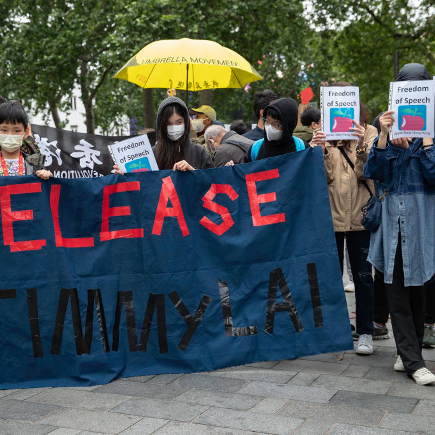 Protesters holding a banner reading, Release Jimmy Lai,