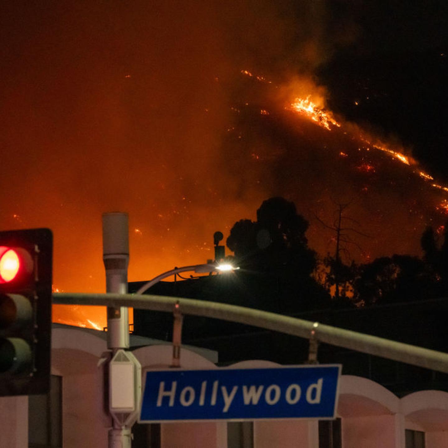 Flames are seen on the hillsides above Hollywood Blvd. during the Sunset Fire in Hollywood, Calif. on Jan. 8, 2025.