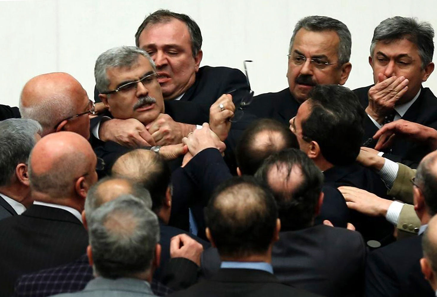 Turkish legislators from Prime Minister Recep Tayyip Erdogan's ruling party and the main opposition Republican People's Party brawl during a tense all-night debate over a controversial law on changes to a council that appoints and overseas judges and pro