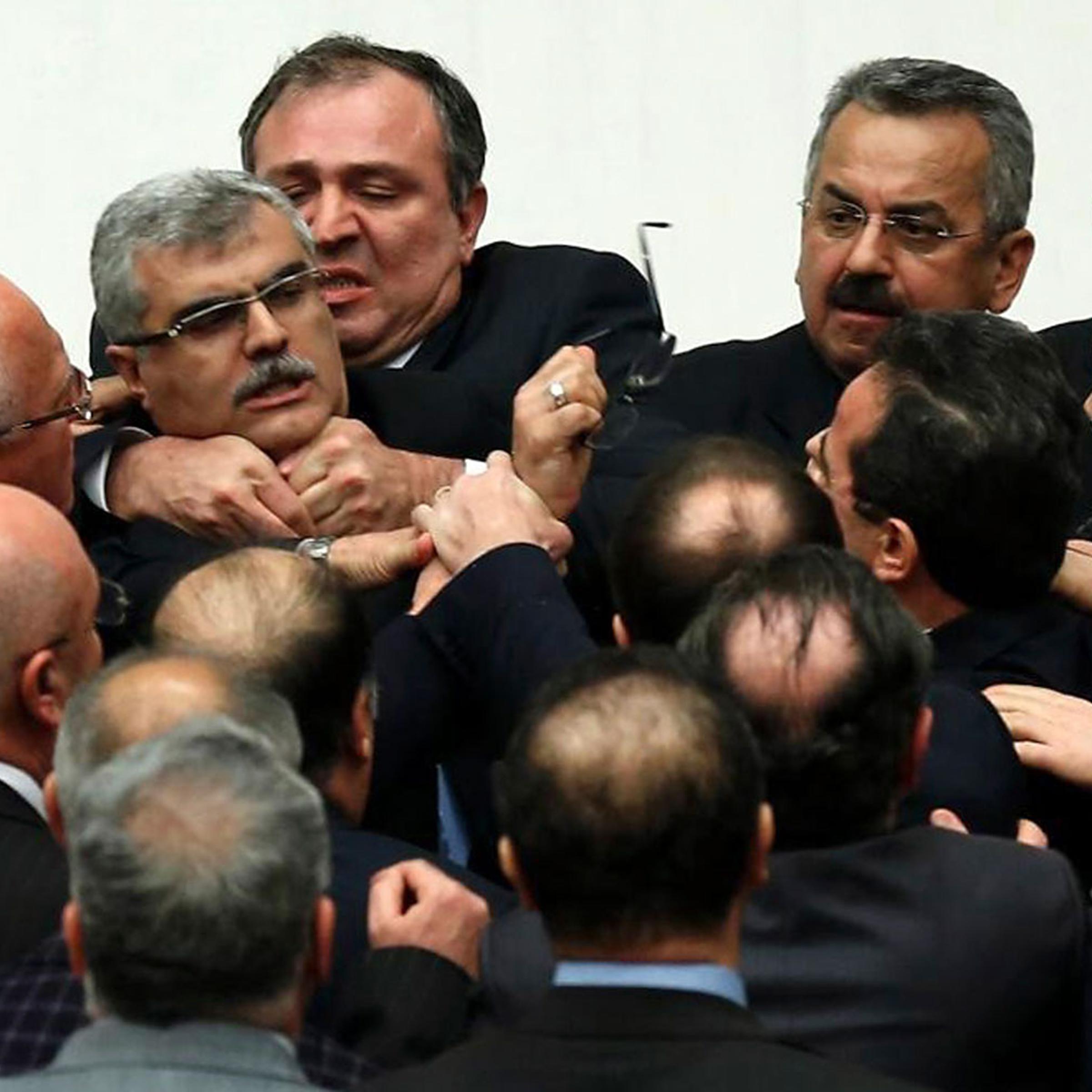 Turkish legislators from Prime Minister Recep Tayyip Erdogan's ruling party and the main opposition Republican People's Party brawl during a tense all-night debate over a controversial law on changes to a council that appoints and overseas judges and pro