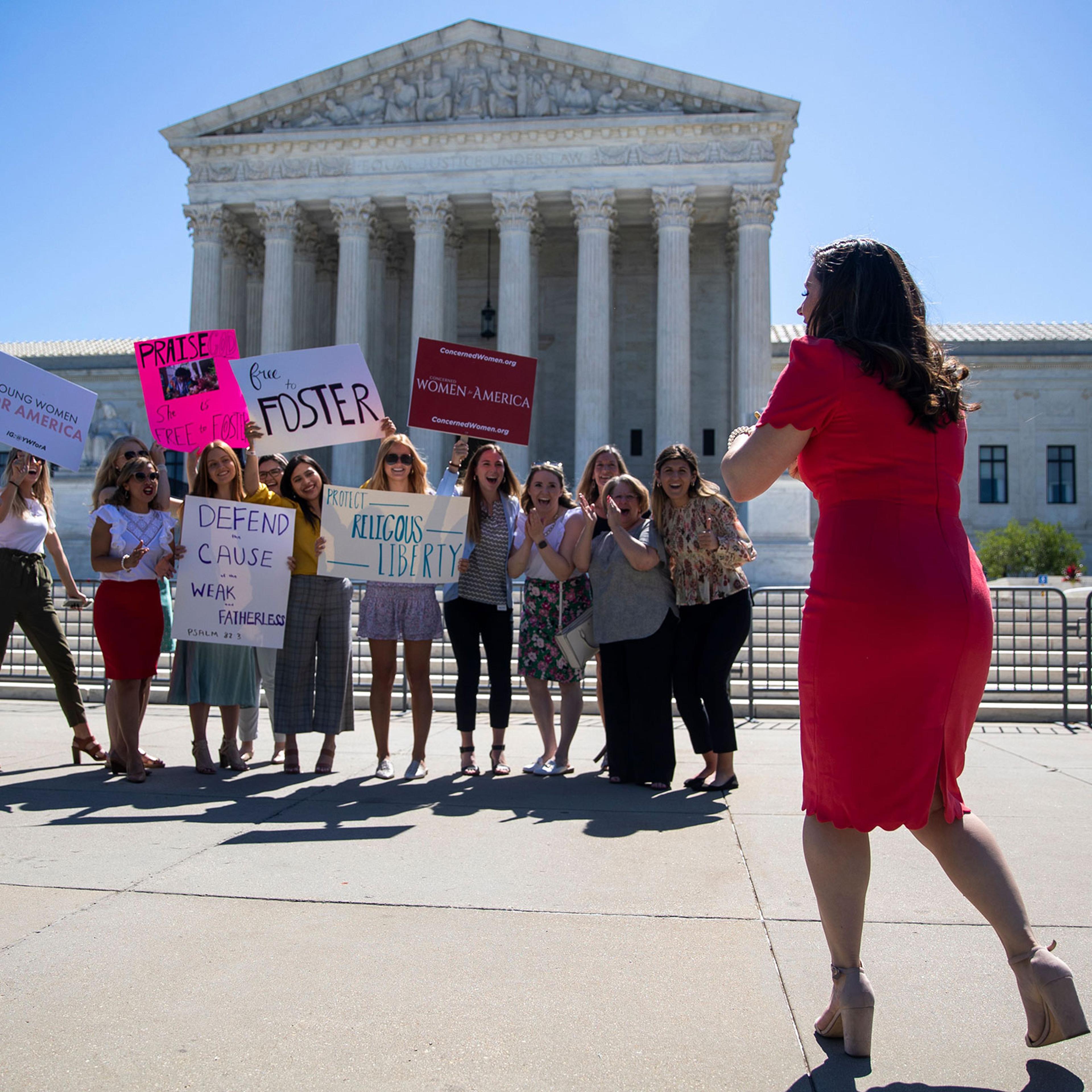 People stand in front of the Supreme Court in Washington, DC, USA, 17 June 2021. The Supreme Court dismissed a challenge to the Affordable Care Act and delivered a unanimous defeat to LGBT couples in a case over whether the city of Philadelphia could ref