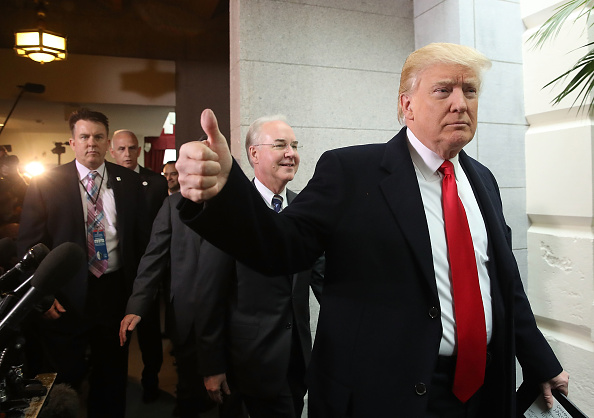 U.S. President Donald Trump gives a thumbs up while walking in the basement of the U.S. Capitol after speaking at a House Republican conference meeting in Washington, D.C., U.S., on Tuesday, March 21, 2017.