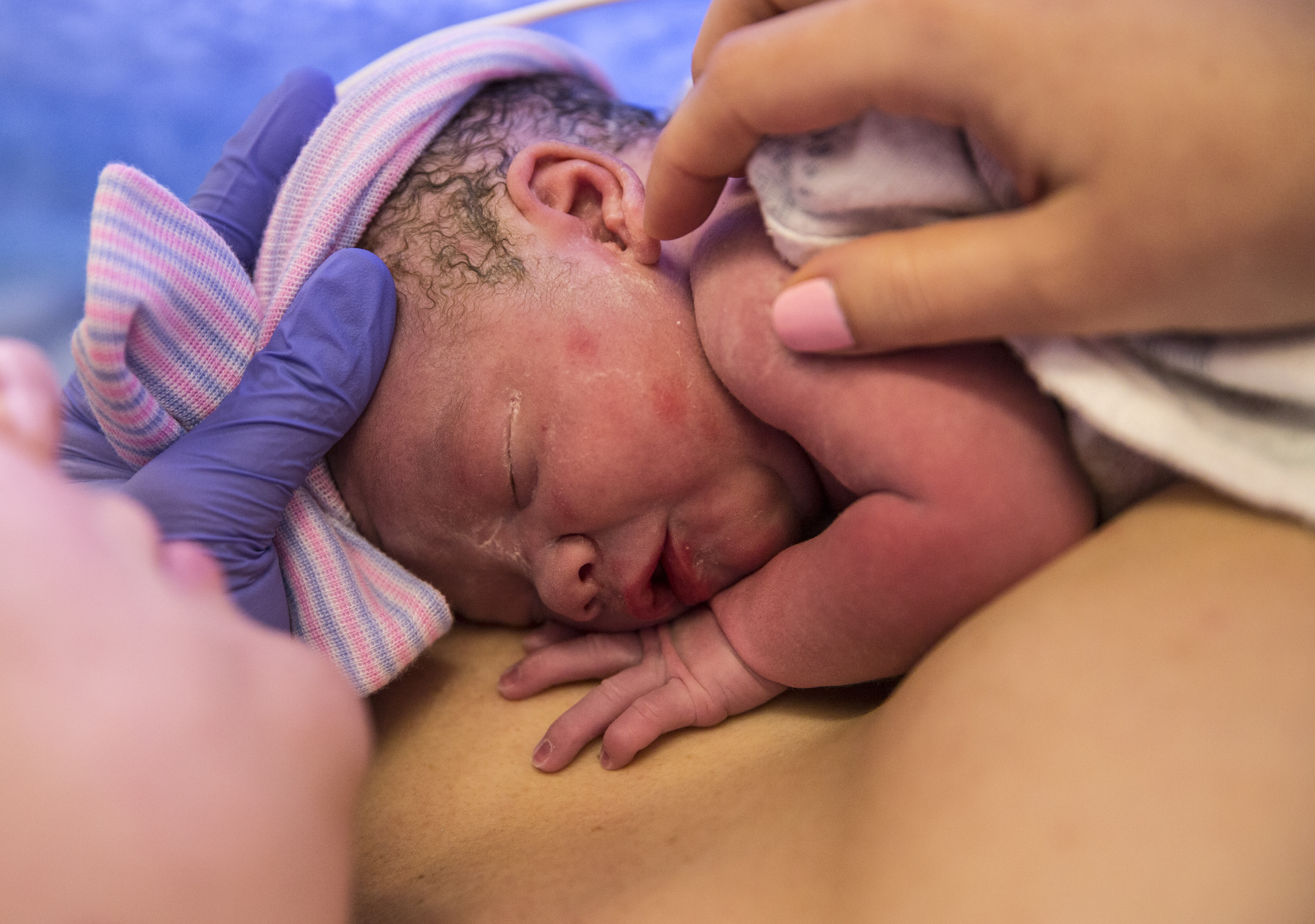 The mother holding her baby in the delivery room in February 2018.