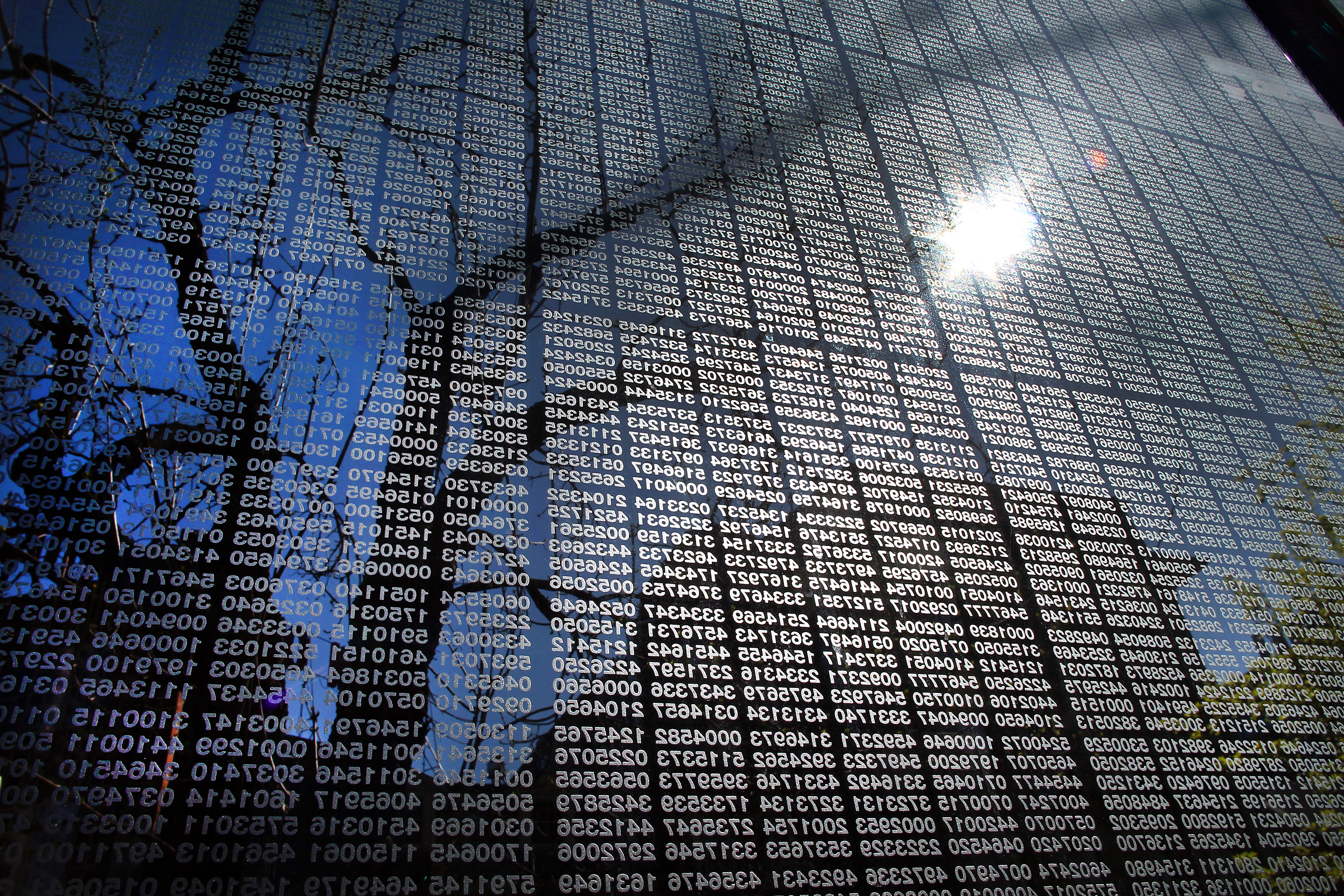 Boston-04/17/2012 The early morning suns shines onto the thousands of numbers of holocaust victims on one of the glass panels at the  Boston Holocaust Memorial on Congress Street. Thursday, April 19 is national Holocaust Day of Remembrance.  Boston Globe