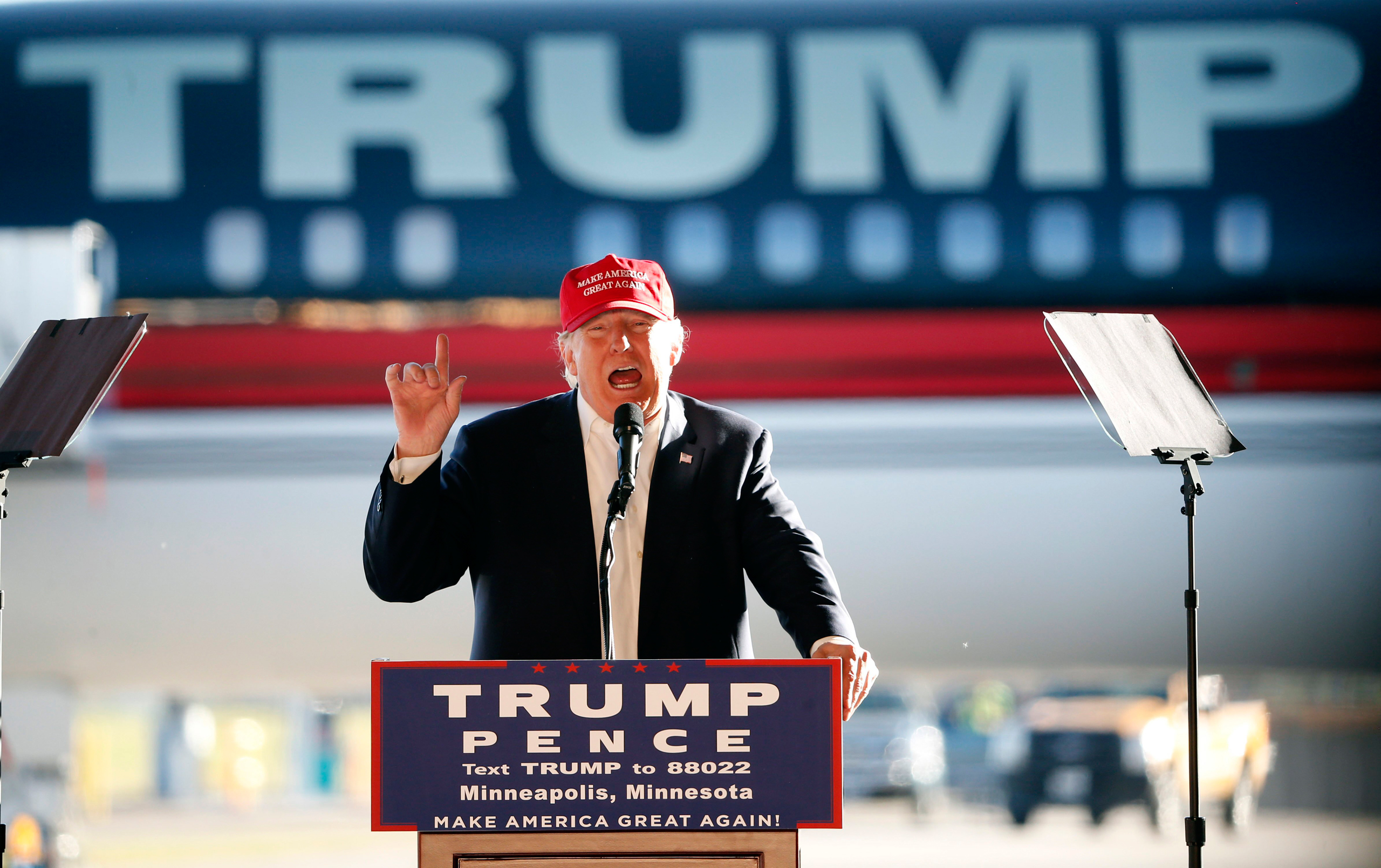 Republican presidential candidate Donald Trump addresses the crowd during a campaign stop at the Minneapolis International Airport Sunday, Nov. 6, 2016, in Minneapolis . (AP Photo/Charles Rex Arbogast)