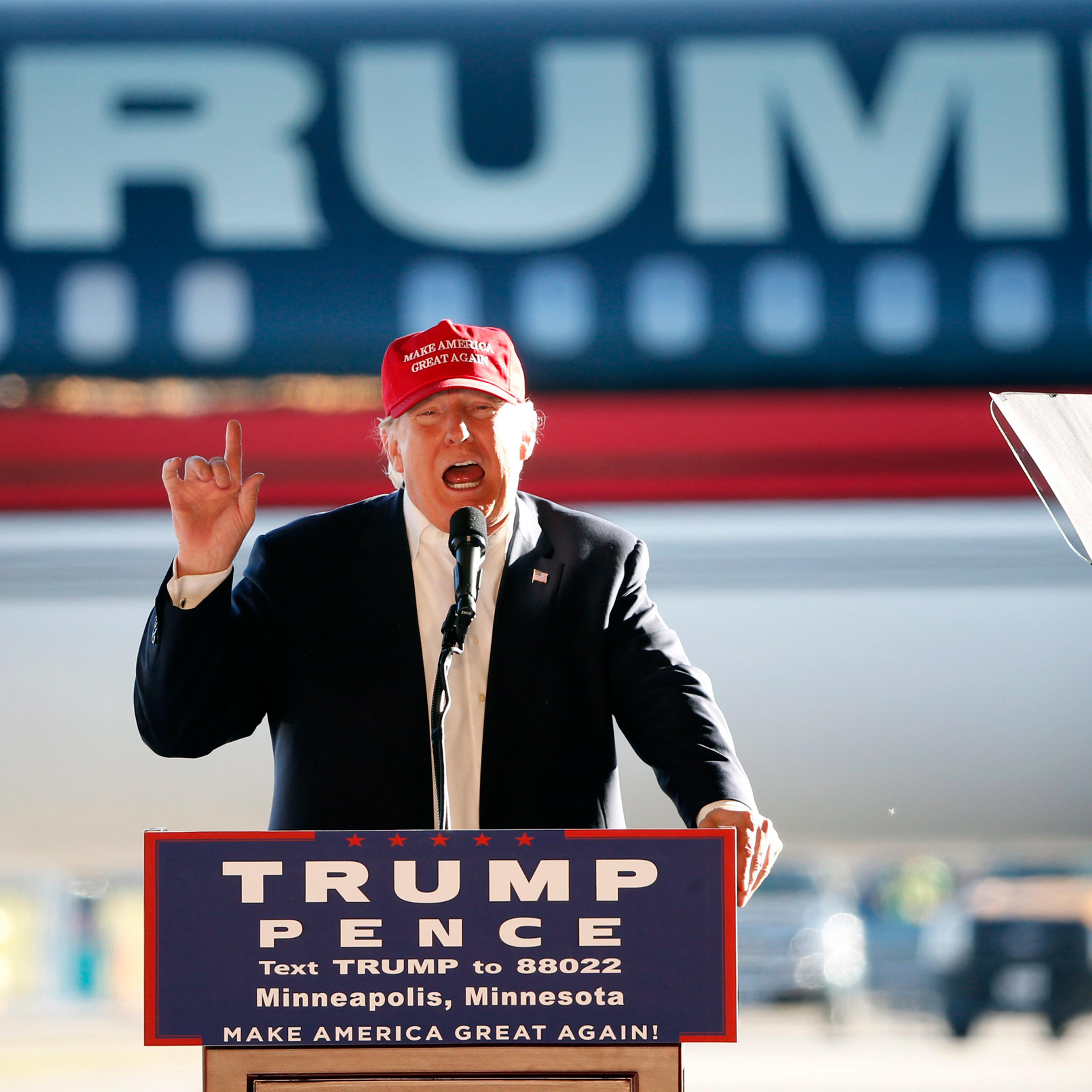 Republican presidential candidate Donald Trump addresses the crowd during a campaign stop at the Minneapolis International Airport Sunday, Nov. 6, 2016, in Minneapolis . (AP Photo/Charles Rex Arbogast)