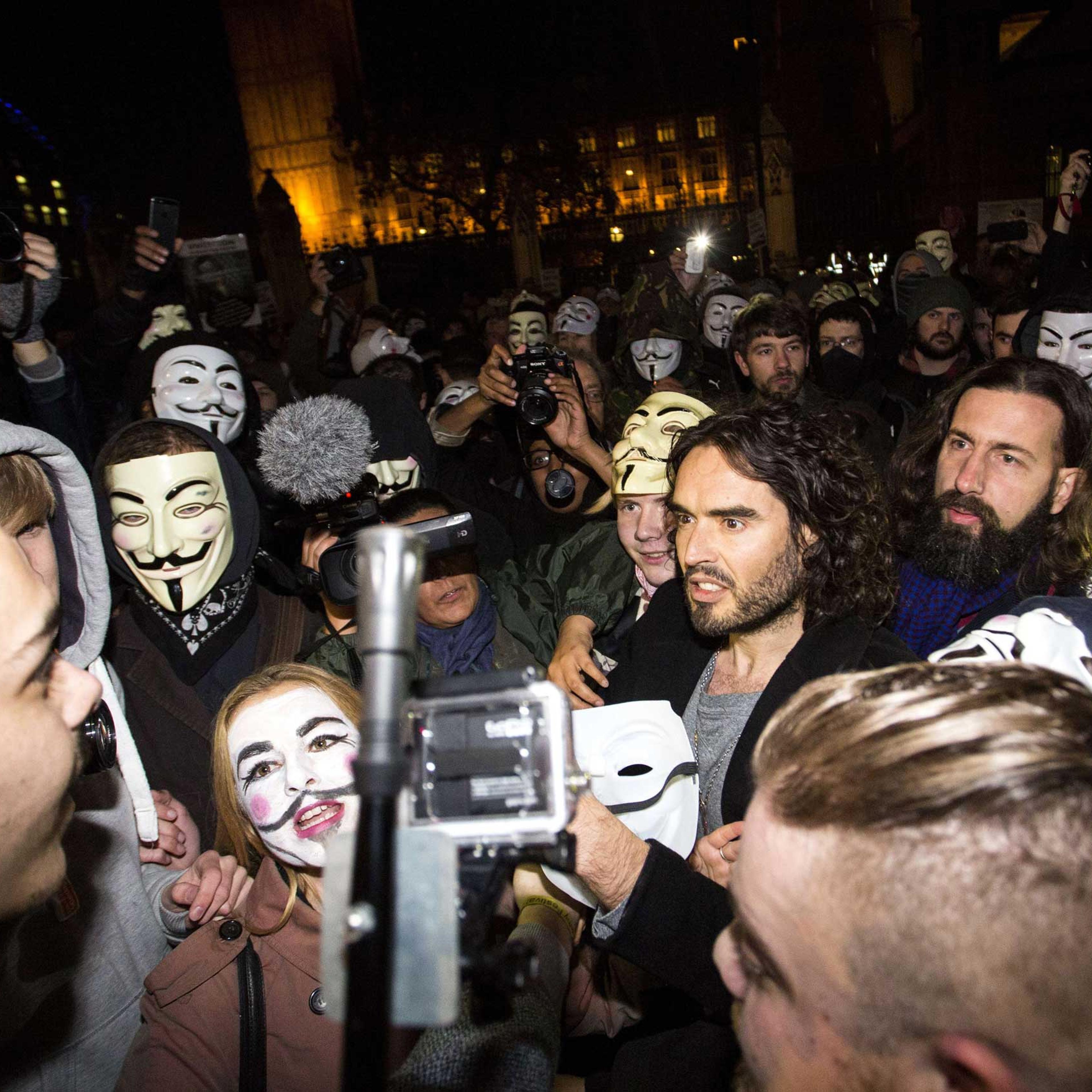 British comedian Russell Brand joins anti-capitalist protesters during the "Million Masks March" in London on Nov. 5, 2014.