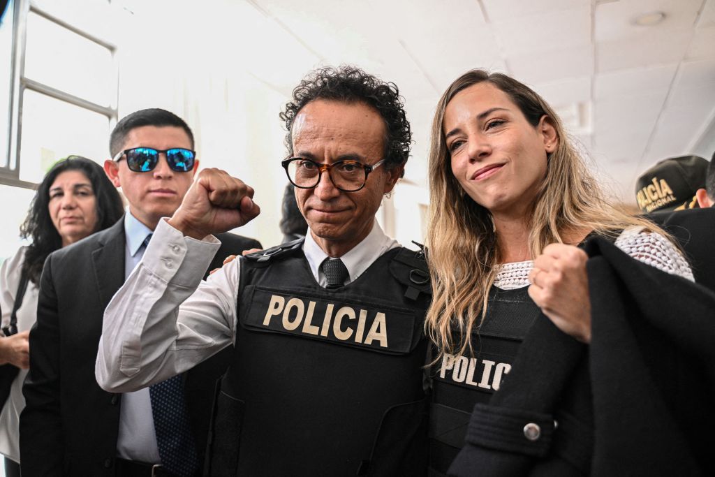 Journalist and presidential candidate for the Construye party, Christian Zurita (C), poses next to his running mate, vice presidential candidate Andrea Gonzalez (R), in Quito on Aug. 13, 2023. Zurita will replace journalist Fernando Villavicencio, who wa