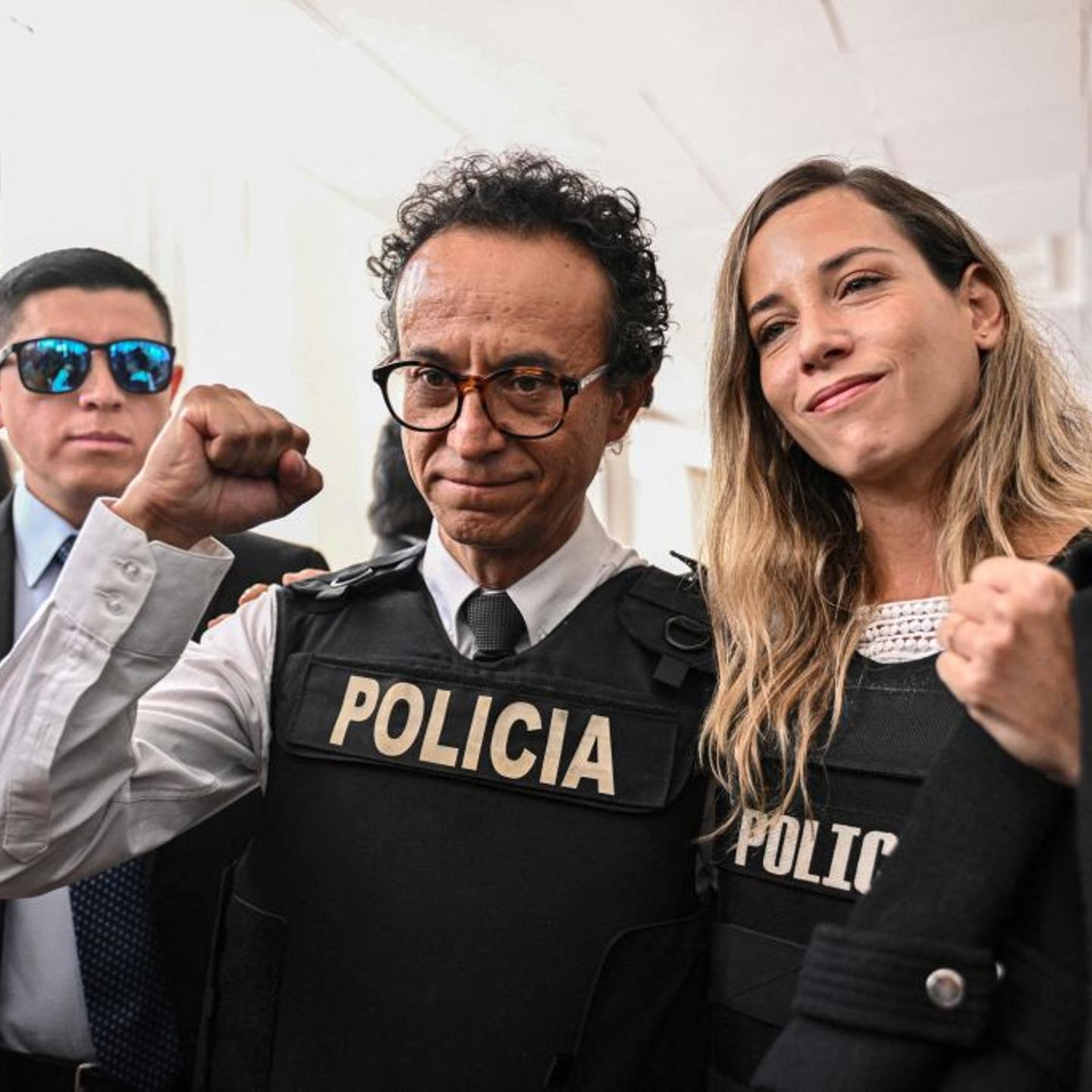 Journalist and presidential candidate for the Construye party, Christian Zurita (C), poses next to his running mate, vice presidential candidate Andrea Gonzalez (R), in Quito on Aug. 13, 2023. Zurita will replace journalist Fernando Villavicencio, who wa
