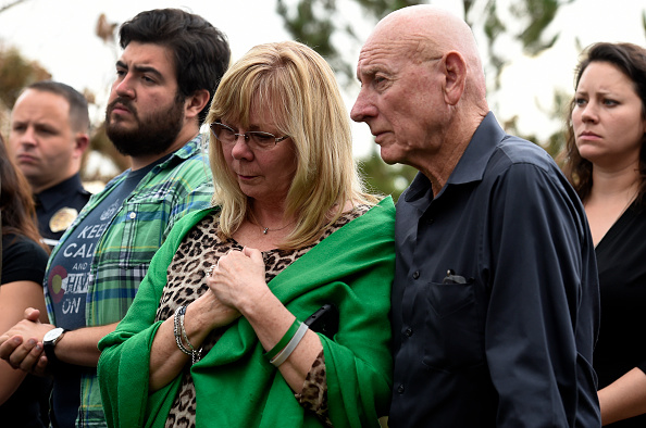 Sandy Phillips, left, and her husband Lonnie, parents of Aurora shooting victim Jessica Ghawi, stand with other family members before addressing members of the media about their reactions to the verdict of life in prison for Aurora Theater shooter James 