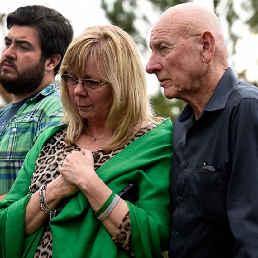 Sandy Phillips, left, and her husband Lonnie, parents of Aurora shooting victim Jessica Ghawi, stand with other family members before addressing members of the media about their reactions to the verdict of life in prison for Aurora Theater shooter James