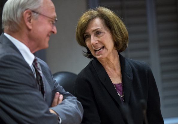 FEC Commissioner Ann Ravel confers with Commissioner Steven Walther before her first meeting at the Commission's downtown office.