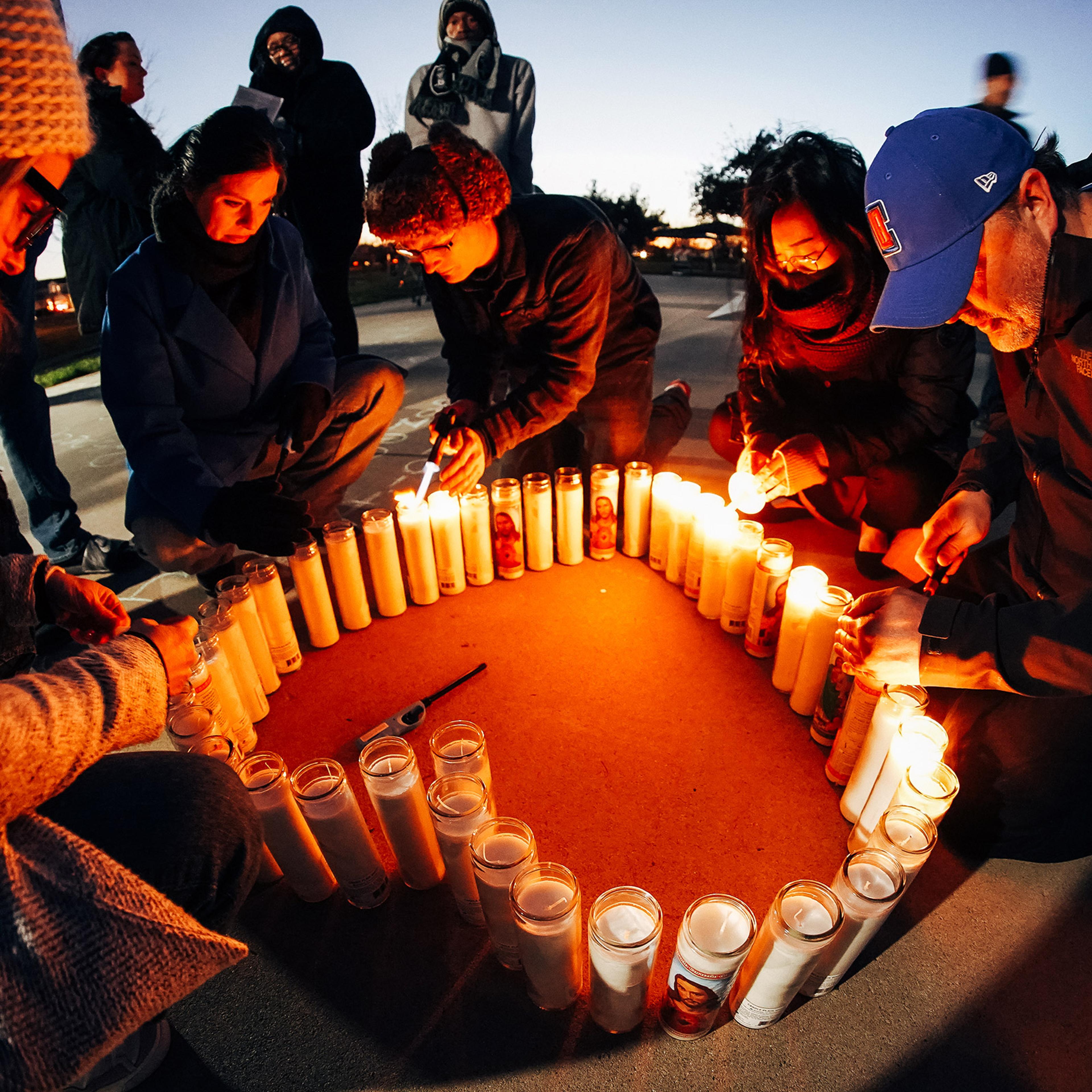 Community members light candles at a Jan. 30 vigil for Tyre Nichols at Regency Community Skatepark, one of the places he used to skate in Sacramento, Calif.