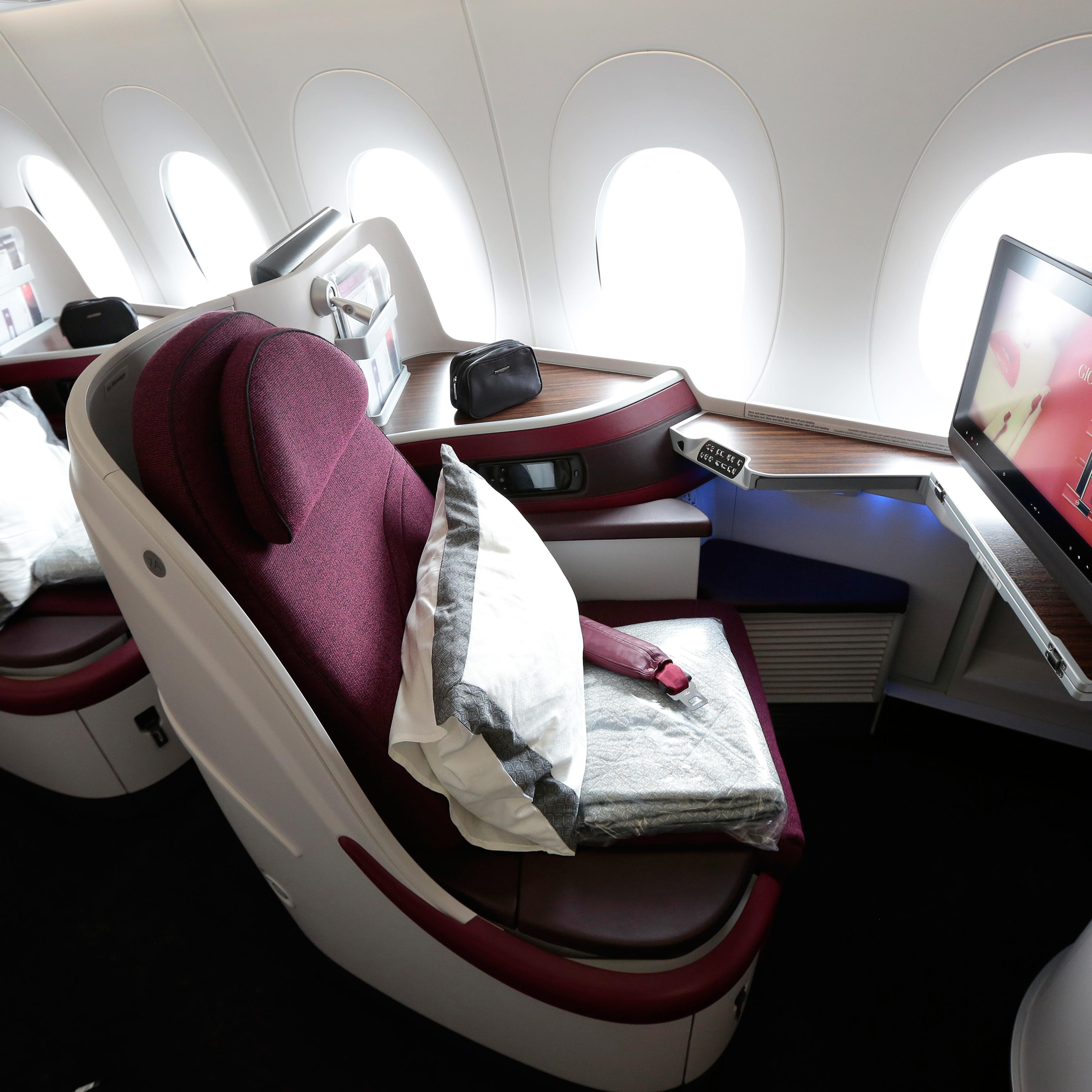 First class cabin booths sit aboard an Airbus SAS A380 aircraft, operated by Qatar Airways Ltd., on the opening day of the 51st International Paris Air Show in Paris, France, on Monday, June 15, 2015.