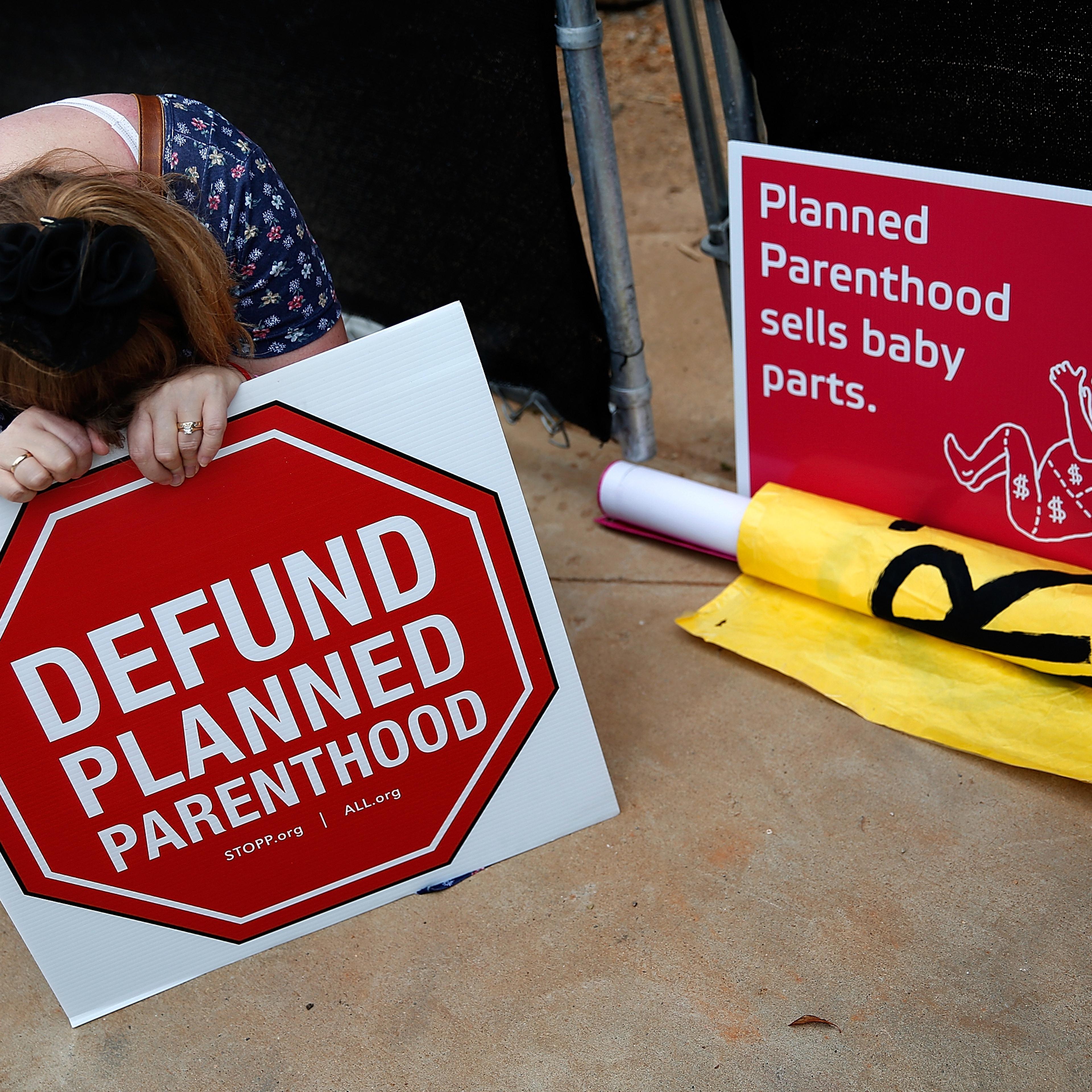 Right to Life advocate Linda Heilman prays during a sit-in in front of a proposed Planned Parenthood location while demonstrating the group's opposition to congressional funding of Planned Parenthood in Washington, DC, on Sept. 21, 2015.