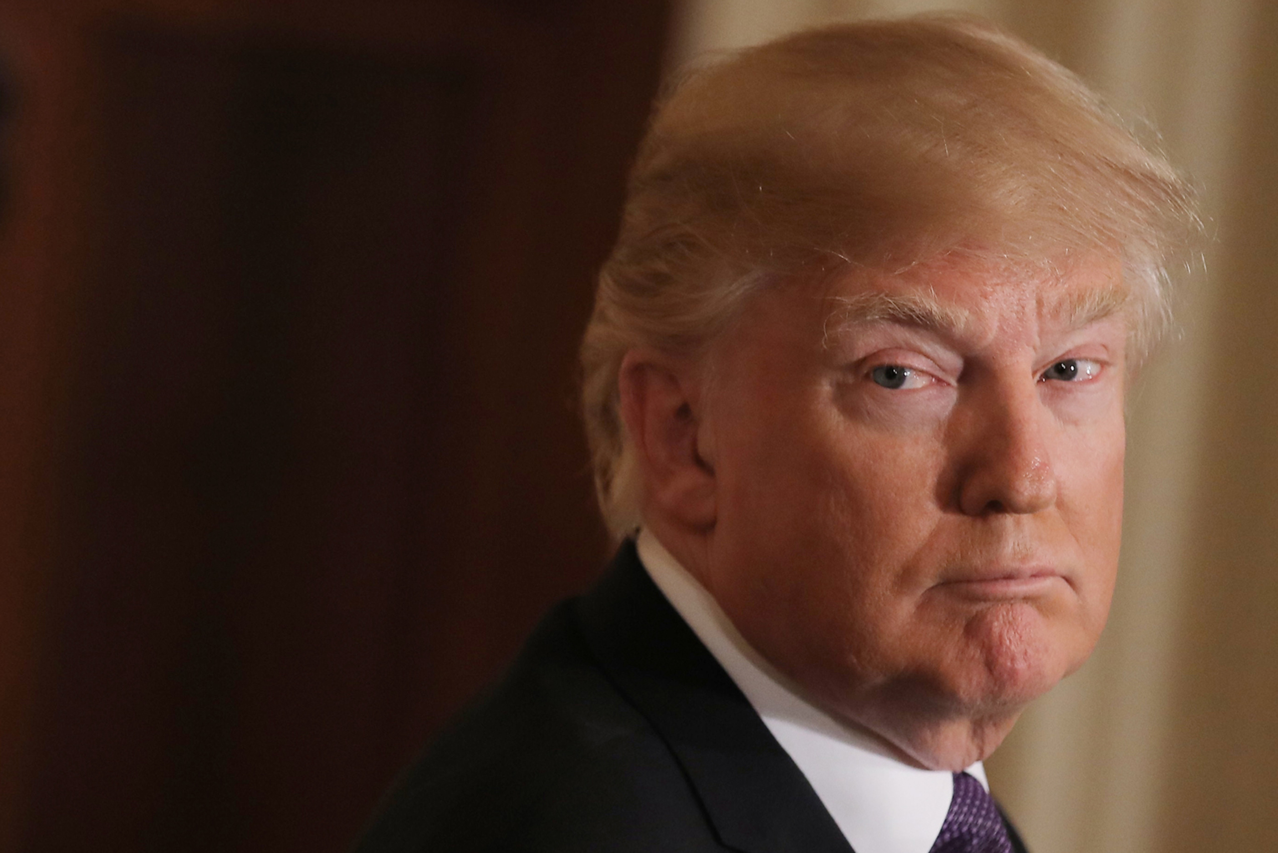U.S. President Donald Trump listens during  joint news conference with Trudeau at the White House in Washington