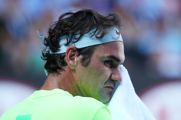 XXX of ZZZZ plays a forehand in his/her third round match against XXXX of ZZZZZ during day five of the 2015 Australian Open at Melbourne Park on January 23, 2015 in Melbourne, Australia.