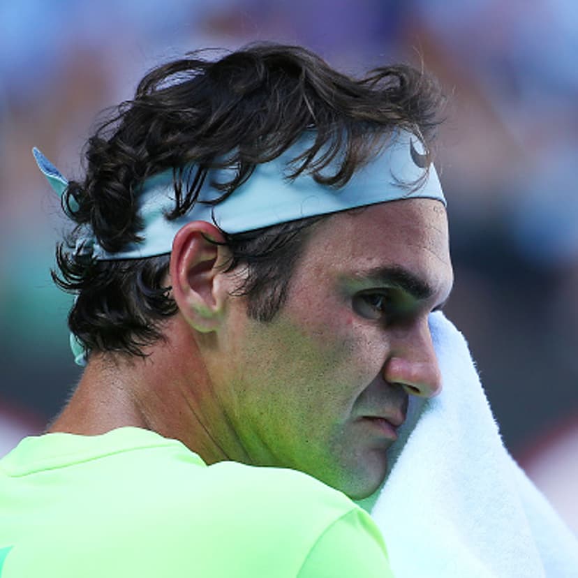 XXX of ZZZZ plays a forehand in his/her third round match against XXXX of ZZZZZ during day five of the 2015 Australian Open at Melbourne Park on January 23, 2015 in Melbourne, Australia.