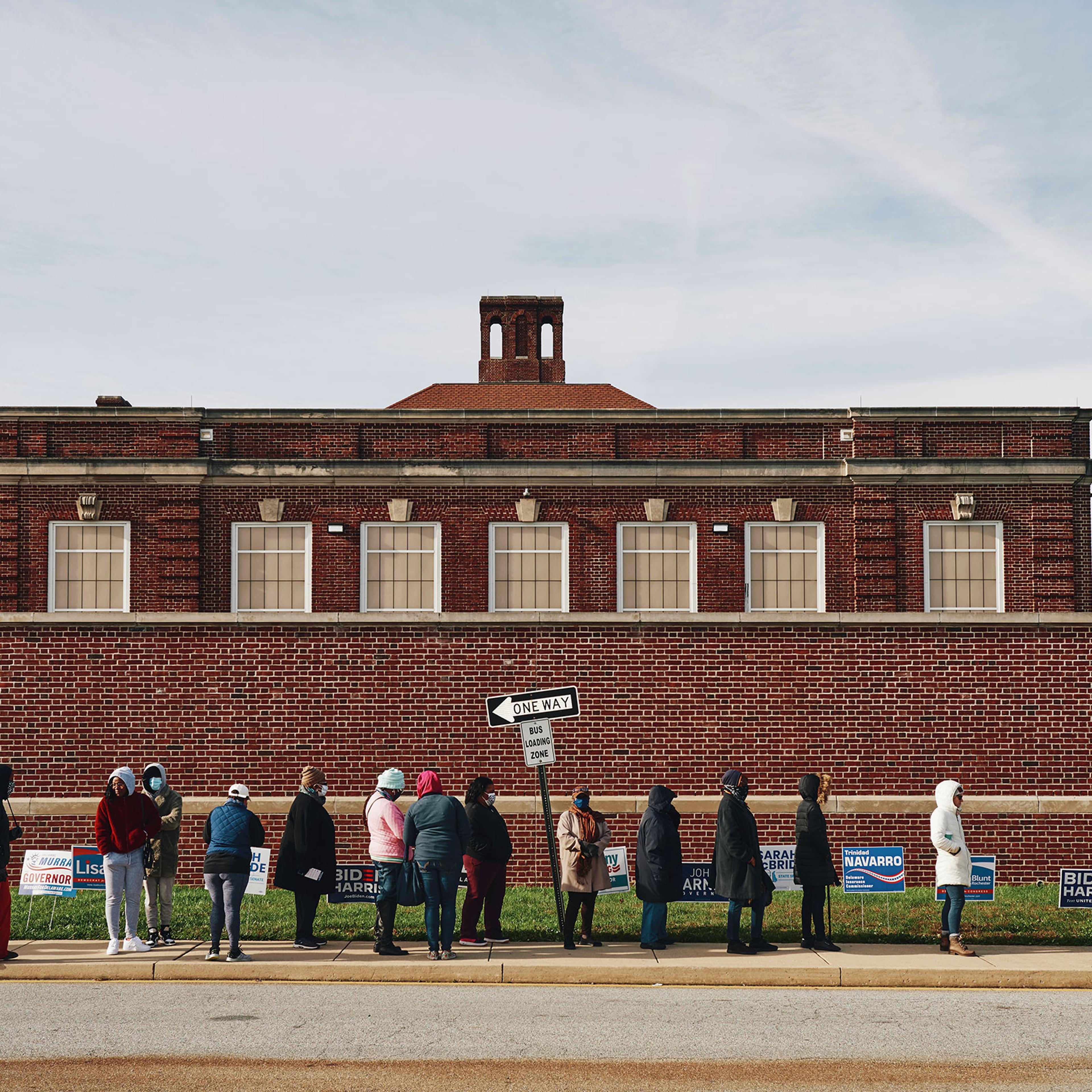 Voters line up outside of a polling location in Wilmington, Del. on Election day, Nov. 3, 2020.