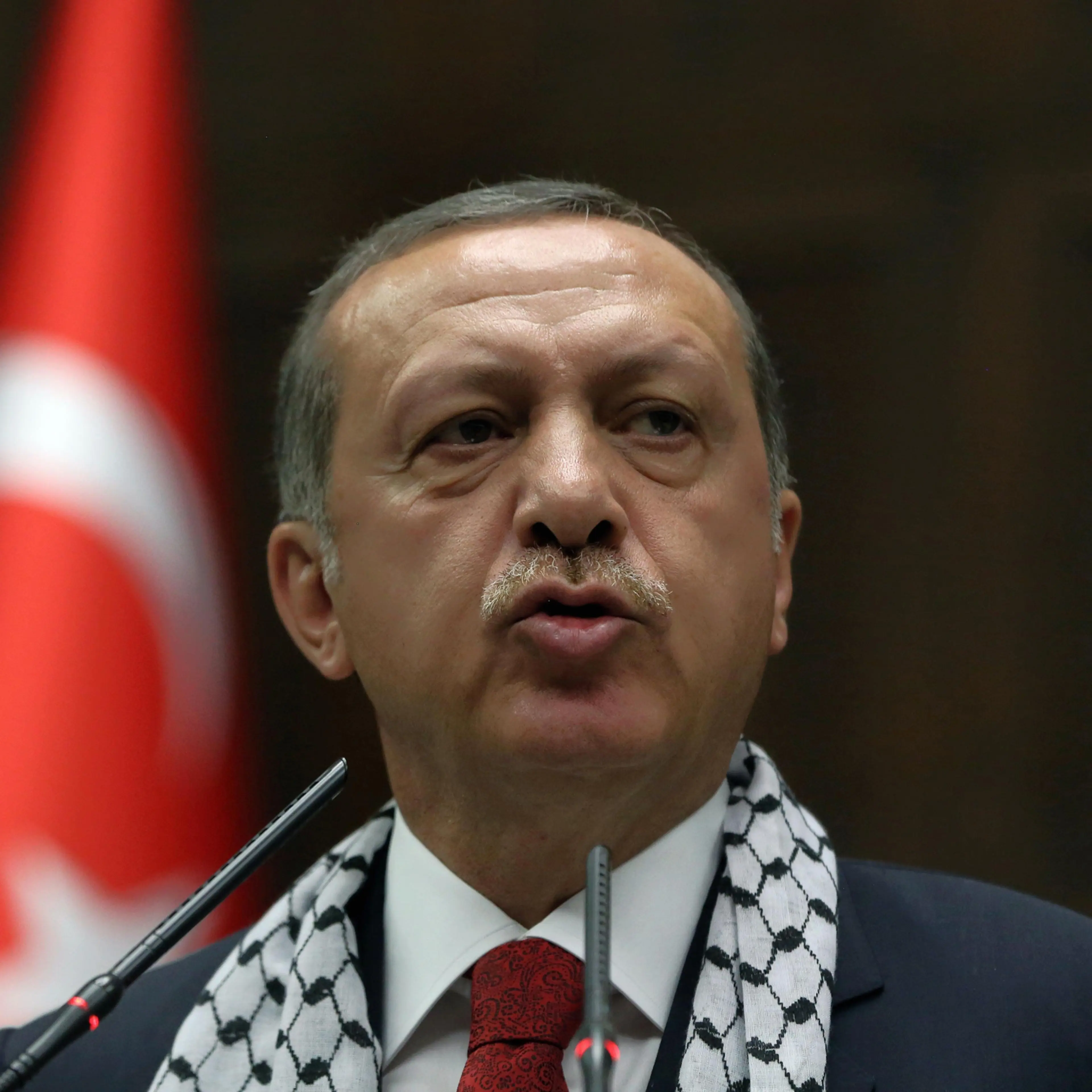 Turkish Prime Minister Recep Tayyip Erdogan addresses his supporters at parliament in Ankara, Turkey, July 22, 2014.