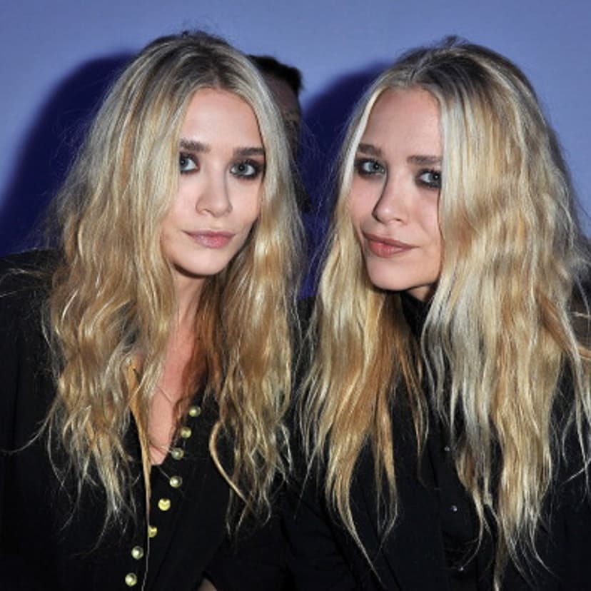 Mary-Kate Olsen and Ashley Olsen attend the Dw by Kanye West Ready to Wear Spring / Summer 2012 show during Paris Fashion Week at Lycee Henri IV on October 1, 2011 in Paris, France.