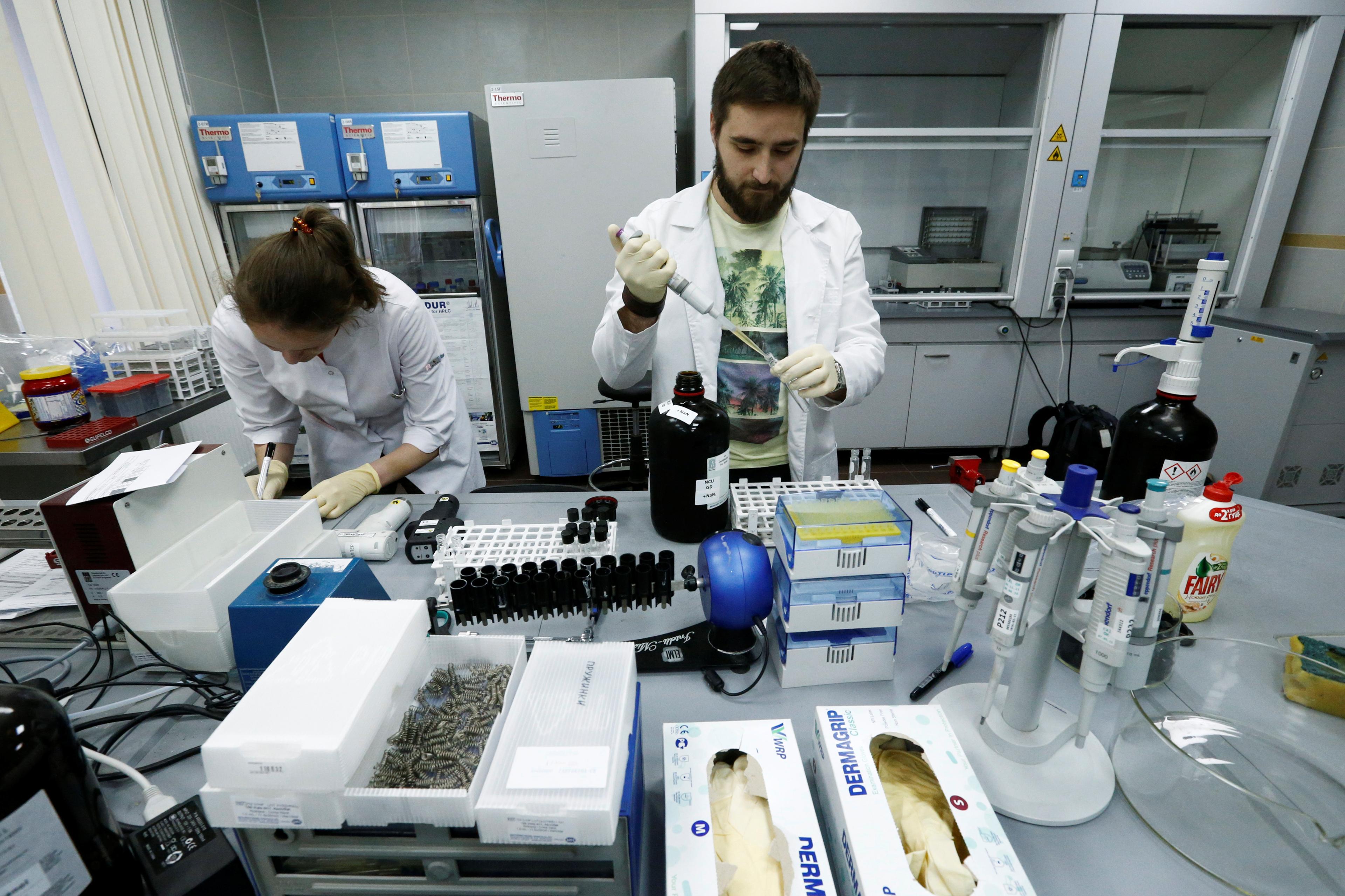 Technicians work at the Russian anti-doping laboratory in Moscow, May 24, 2016.
