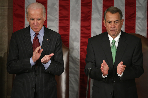 U.S. Vice President Joe Biden (L) and Speaker of the House John Boehner (R-OH) applaud for Afghanistan President Ashraf Ghani during his address to a joint meeting of the United States Congress in the House Chamber at the U.S. Capitol March 25, 2015 in W