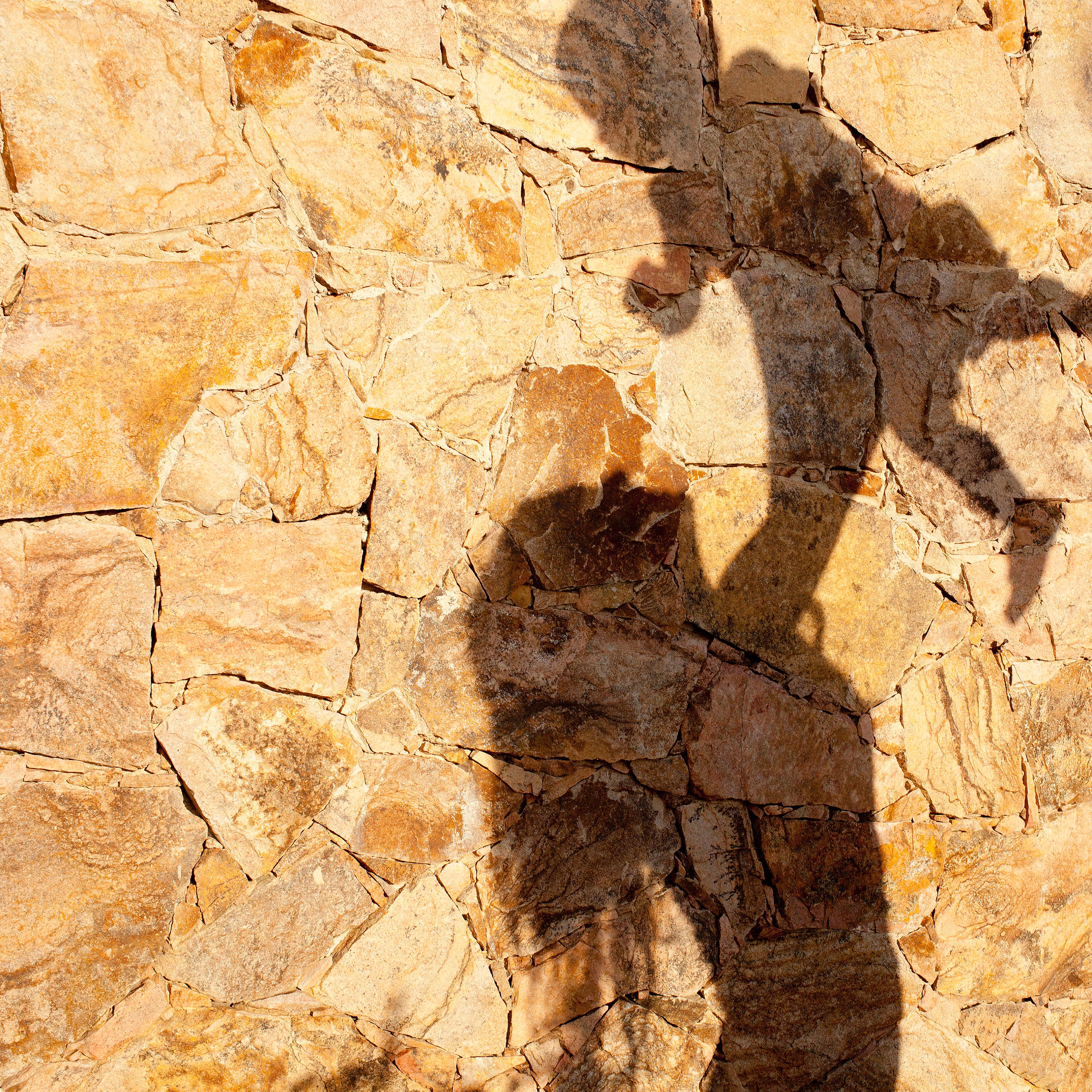 Shadow of mother lifting baby