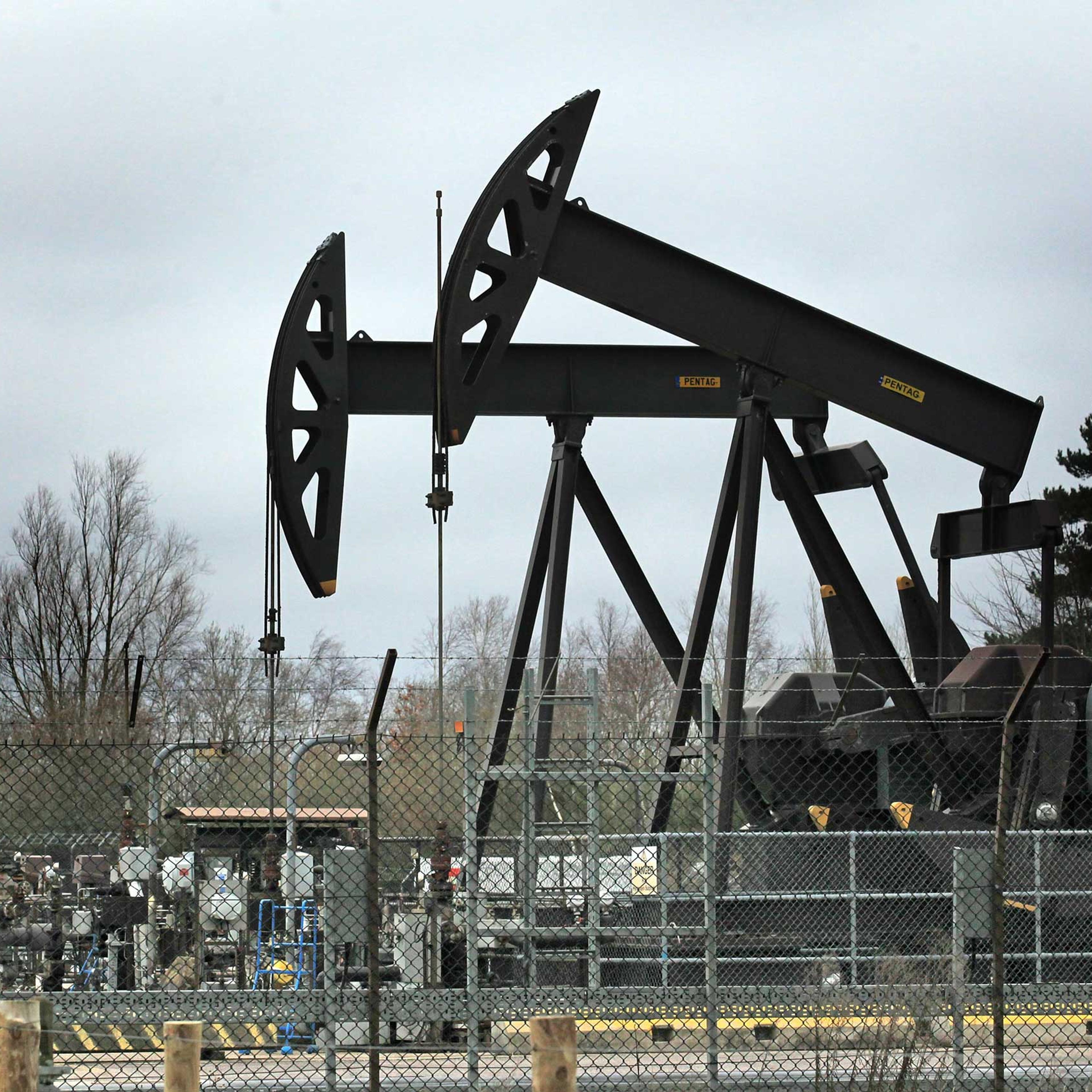 Nodding donkey pumping units work at one of the oil wells at western Europe's largest onshore oil field near Poole, United Kingdom, in 2011.