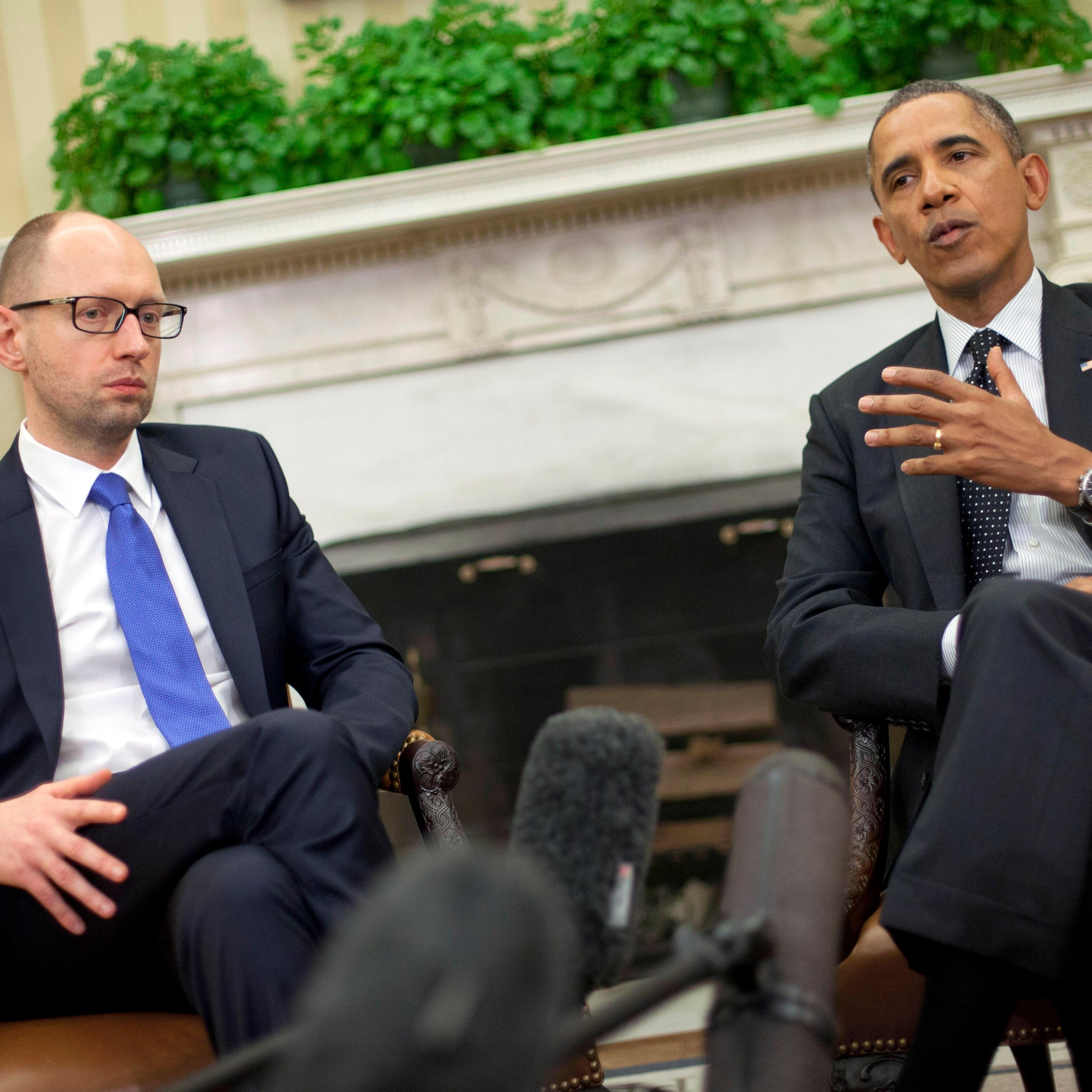 President Barack Obama, right, with Ukraine Prime Minister Arseniy Yatsenyuk, left, talk in the Oval Office of the White House in Washington