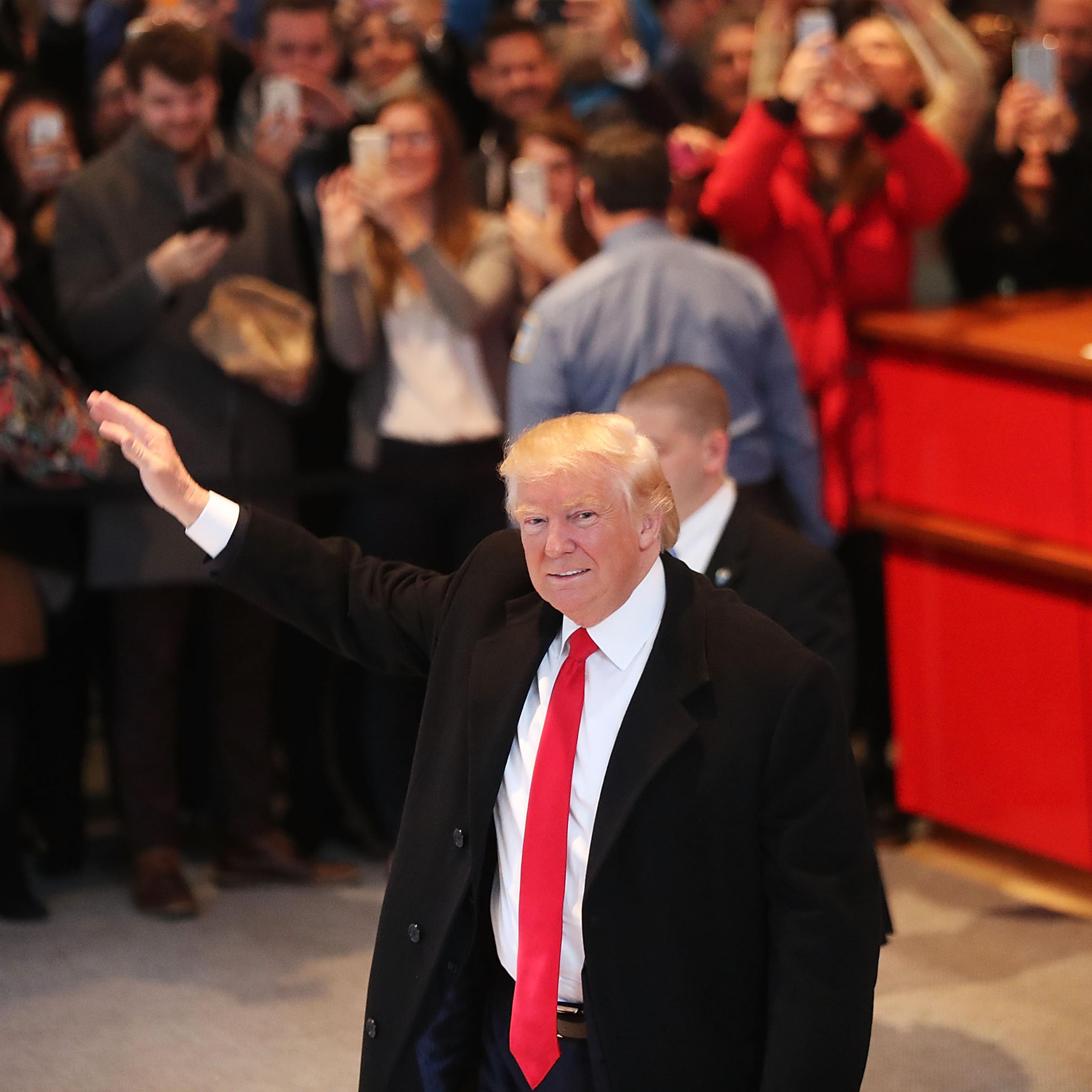 President-elect Donald Trump walks through the lobby of the New York Times following a meeting with editors at the paper in New York City on Nov. 22, 2016.