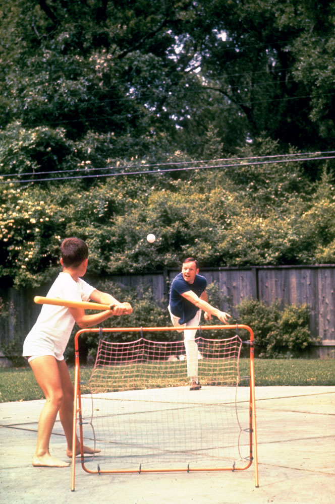 Neil Armstrong plays ball with his son, 1969.