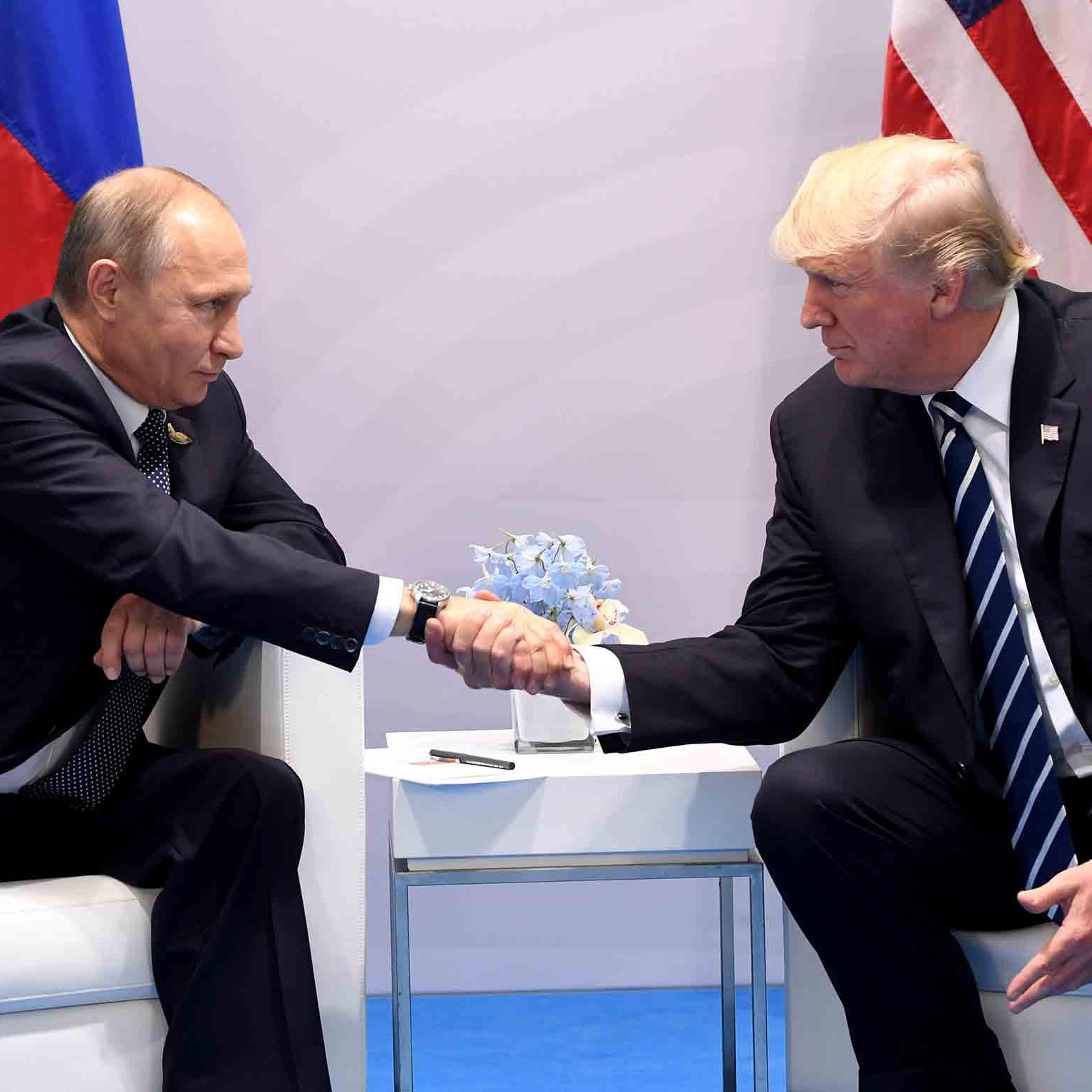 President Donald Trump and Russia's President Vladimir Putin shake hands during a meeting on the sidelines of the G20 Summit in Hamburg, Germany, on July 7, 2017.