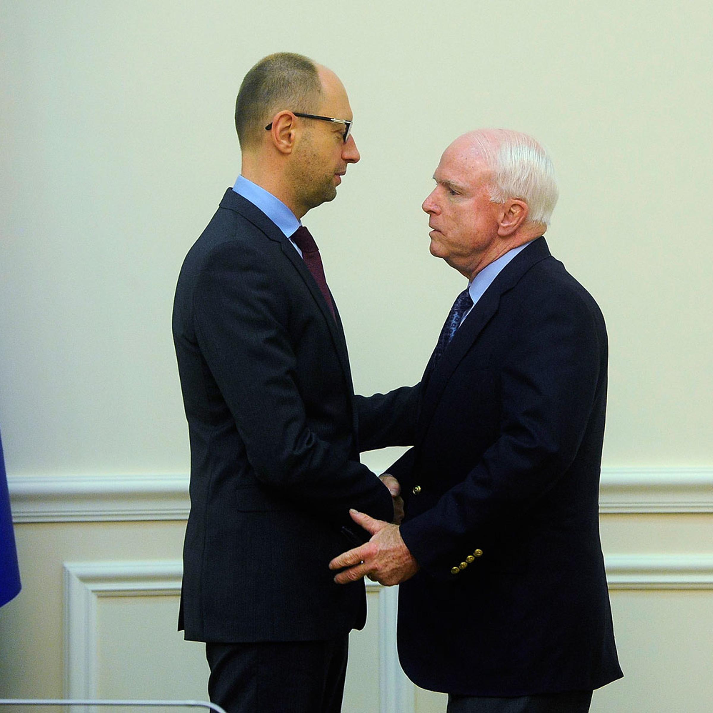 Ukraine's Prime Minister Arseny Yatseniuk (L) meets with U.S. Senator John McCain in Kiev