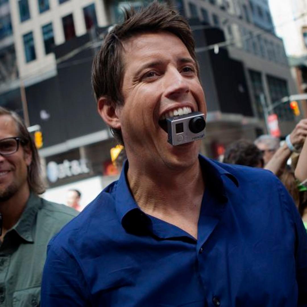 Nick Woodman, founder and chief executive officer of GoPro, looks up at displays of his company's ads in Times Square after the opening bell for the release of the company's IPO at the Nasdaq MarketSite in New York, NY, Thursday June 26, 2014.